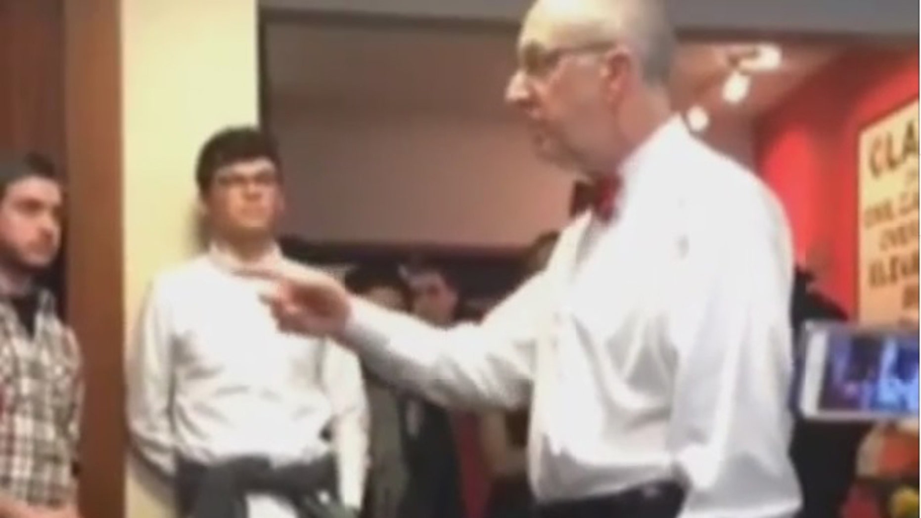 Cornell president David Skorton had a "testy" exchange with students who stormed his office in protest of health care opt-out fees by the school.