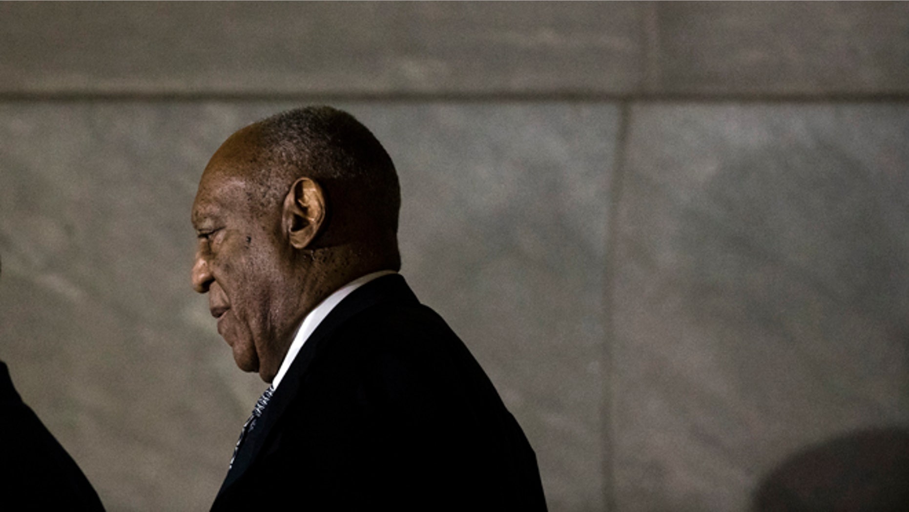 Bill Cosby walks from the Montgomery County Courthouse during his sexual assault trial.