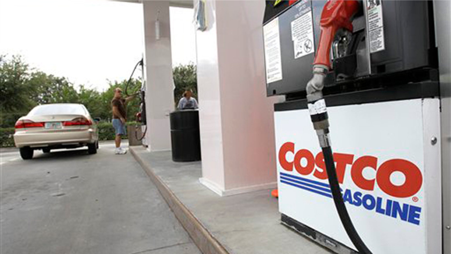 Nov. 8, 2011: Customers pump gasoline at a Costco gas station in Winter Park, Fla.