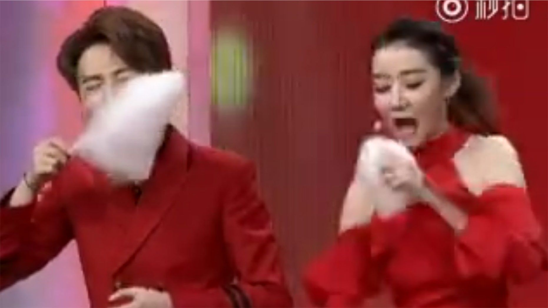 A Chinese game show host is being hailed as "amazing" after showcasing her bizarre technique for eating cotton candy.