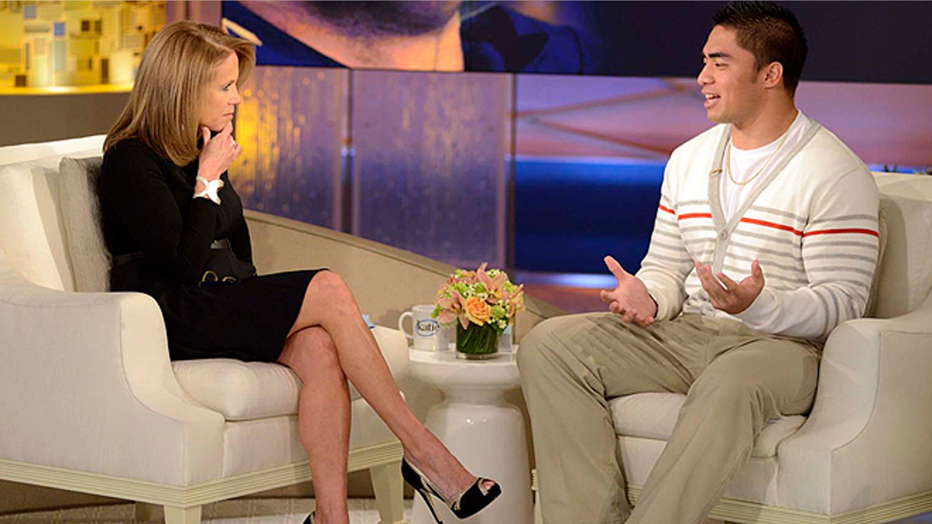 Jan. 22, 2013: Notre Dame linebacker Manti Te'o, right, speaking with host Katie Couric during an interview for 'Katie' in New York. Te'o told Couric he briefly lied about his online girlfriend after discovering she didn't exist, but maintained he had no part in creating the hoax. (AP/Disney-ABC)