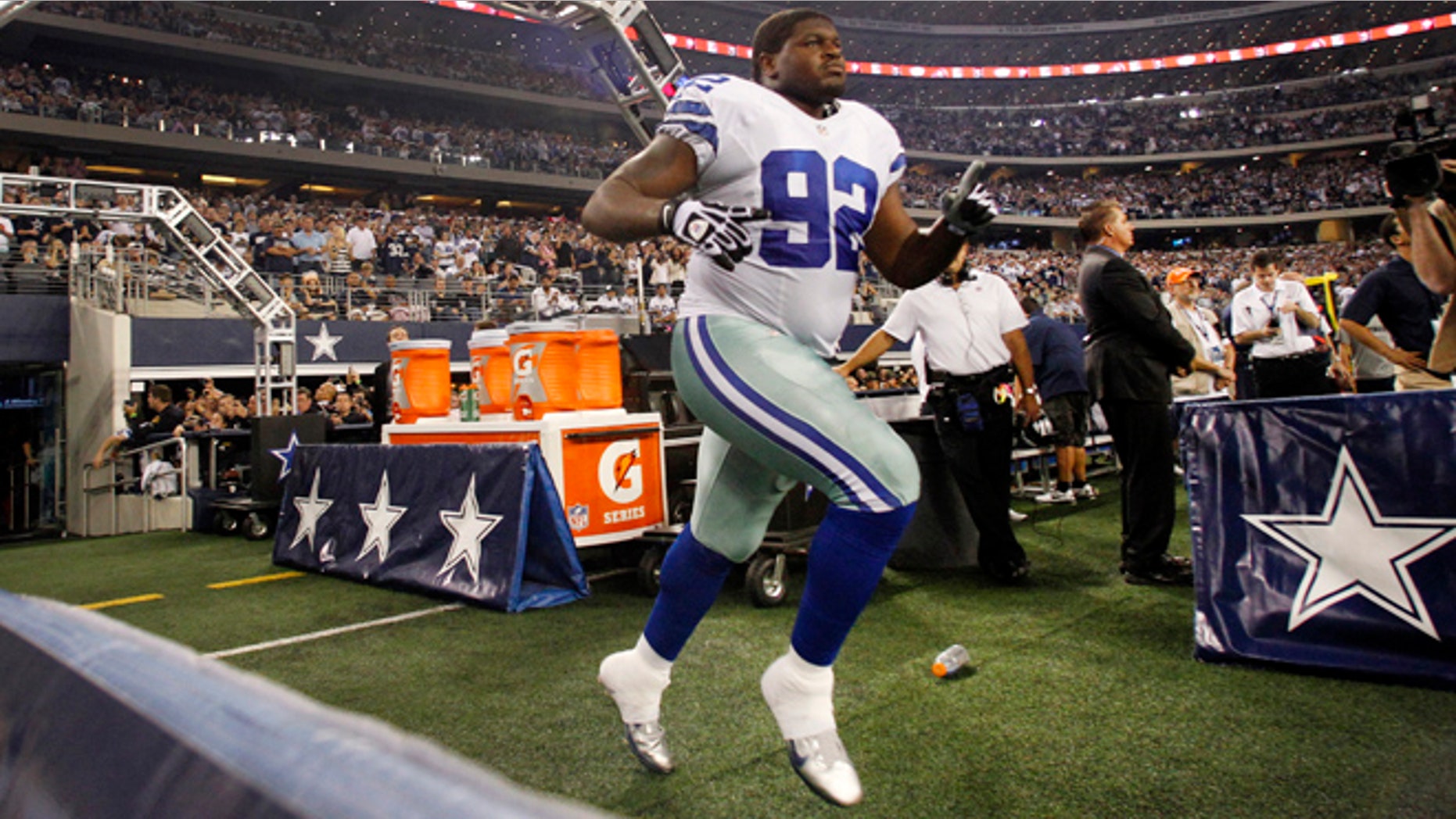 Dec. 2, 2012: In this photo, Dallas Cowboys nose tackle Josh Brent runs onto the field out of the team's tunnel after being introduced before an NFL football game against the Philadelphia Eagles in Arlington, Texas.