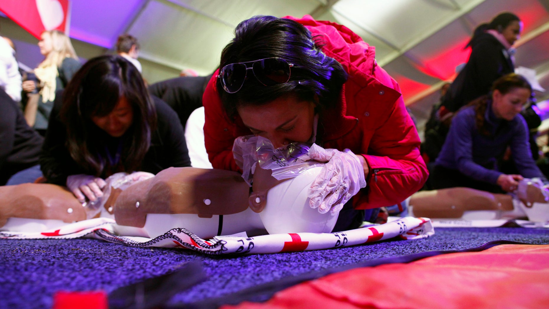 People learn CPR as part of a National Day of Service event on the National Mall in Washington D.C. January 19, 2013. REUTERS/Eric Thayer