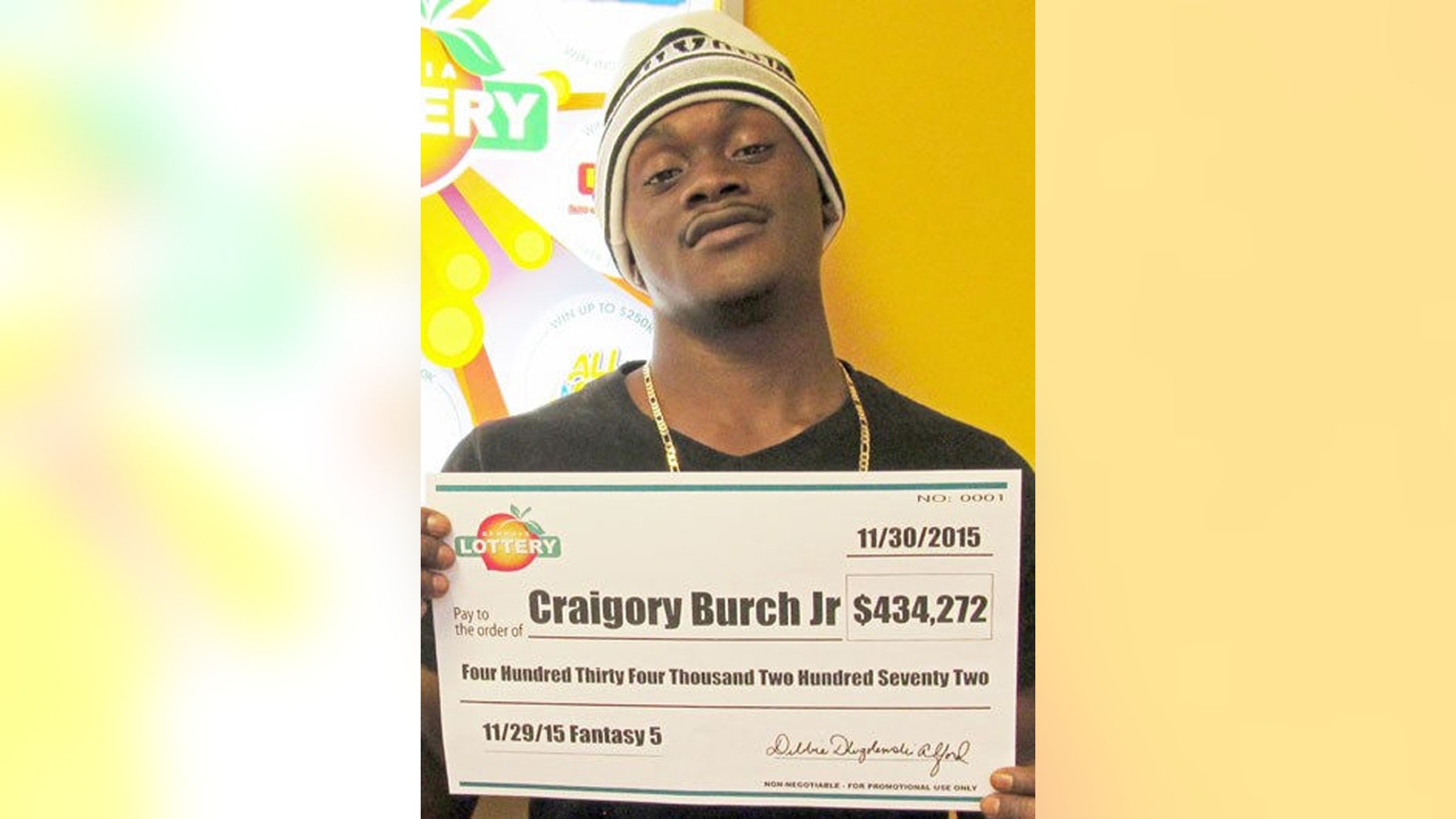 Nov. 30, 2016: This photo shows Craigory Burch Jr. with his winnings from the George Lottery's Fantasy 5 game. Burch was shot and killed in an attempted robbery on Jan. 20 of this year.