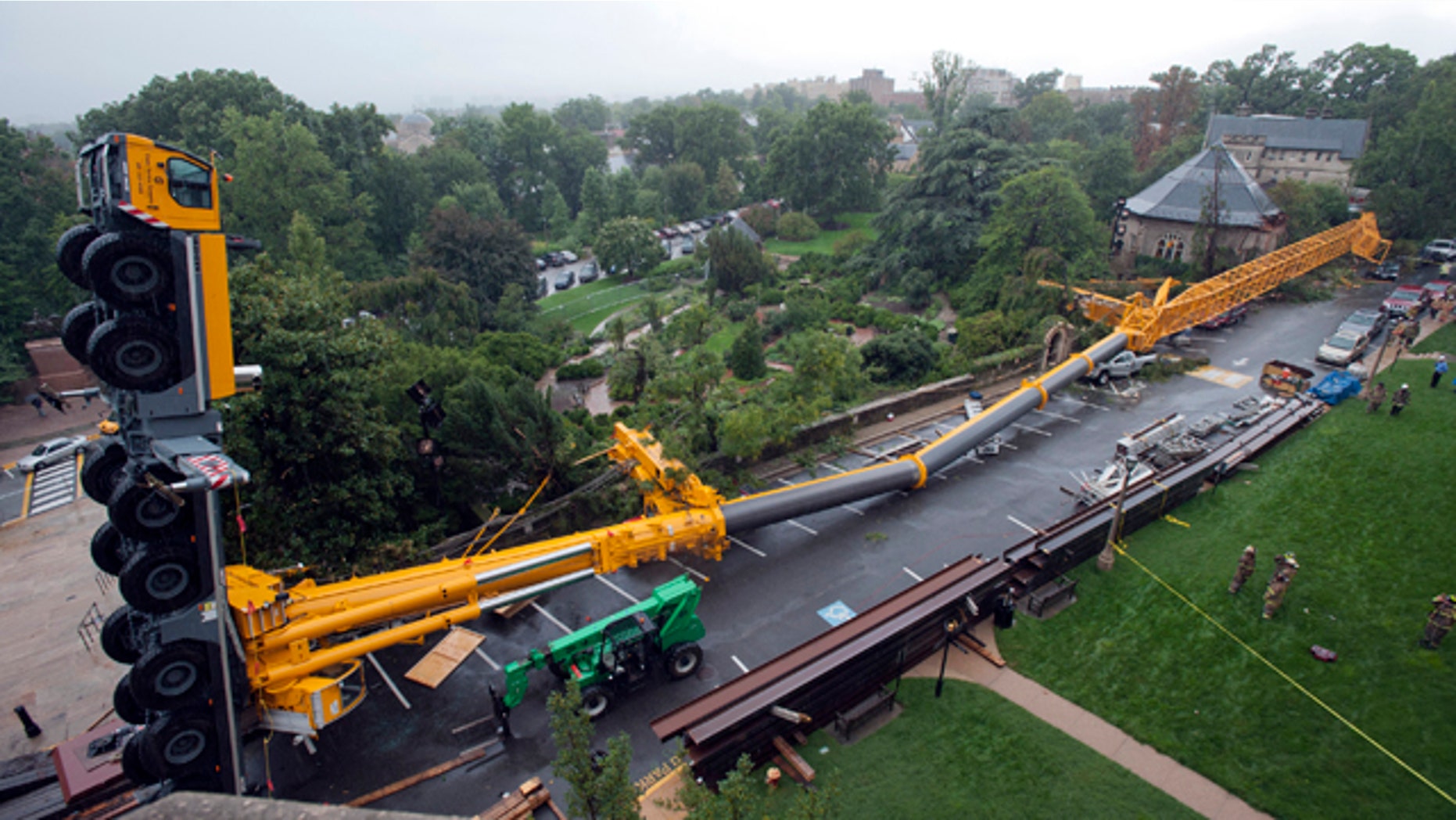 This image released the the National Cathedral shows a 500-ton crane that was doing repair work caused by the Aug. 23 east coast earthquake after it collapsed Wednesday, Sept. 7, 2011, at the Washington National Cathedral in Washington.