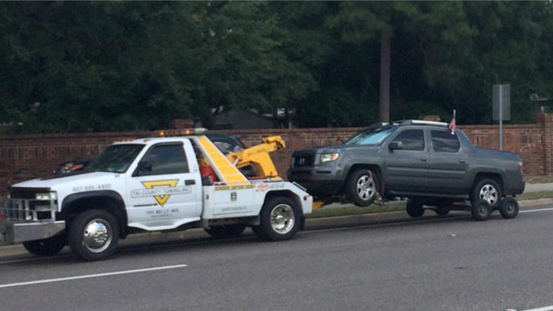 Mon. 11, 2015: A truck is towed at the scene of a shooting involving George Zimmerman near Trailhead Park in Lake Mary, Fla. (AP)