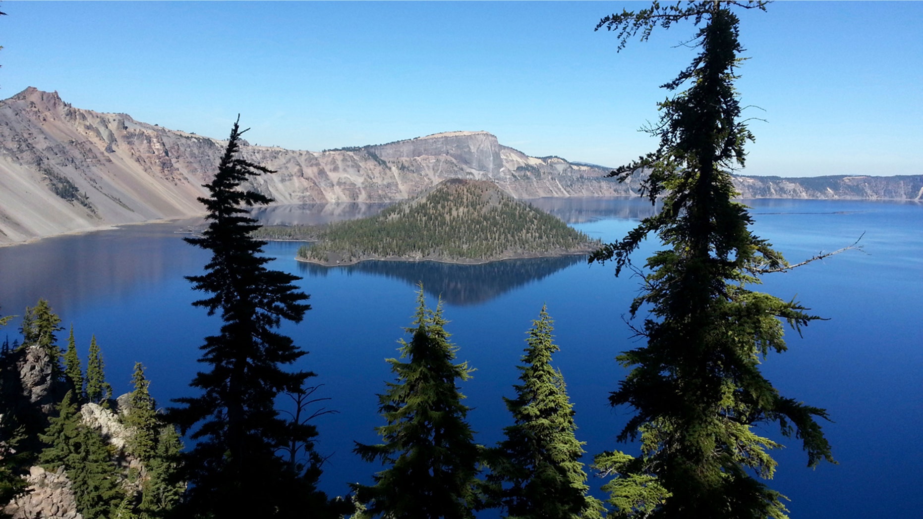 This Oct. 5, 2015, file photo shows Wizard Island in Crater Lake from the rim trail between Rim Village and Watchman Peak at Crater Lake, Ore.