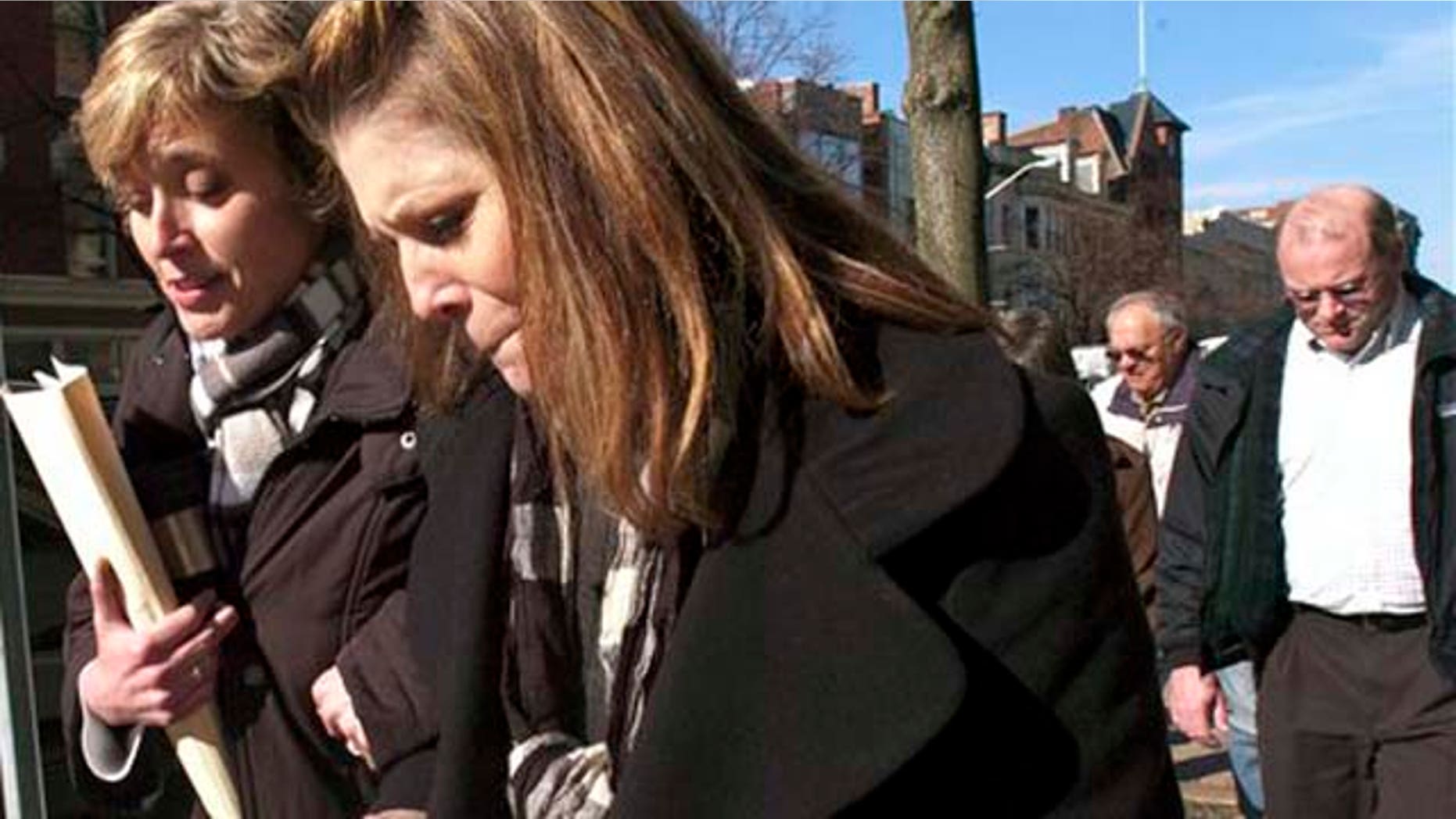 November 18, 2011: Nanette Craver, second from left, and her husband, Michael, rear right, leave the York County Judicial Center.