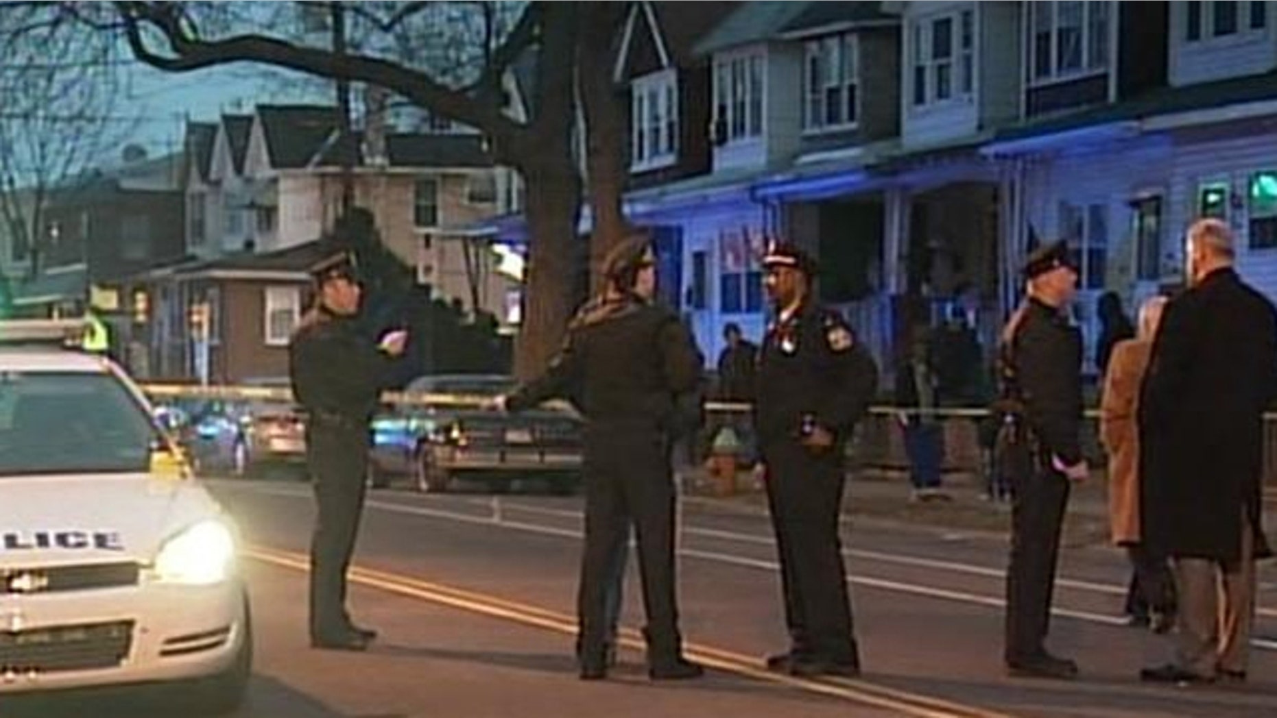 Police inspect the crime scene after a fatal Valentine's Day shooting.
