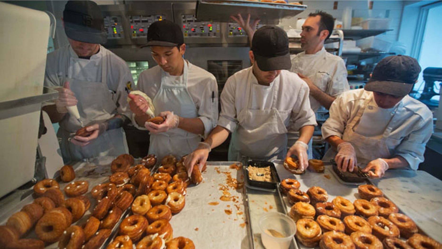 Bakers making Cronuts, a croissant-donut hybrid, at the Dominique Ansel Bakery in New York.