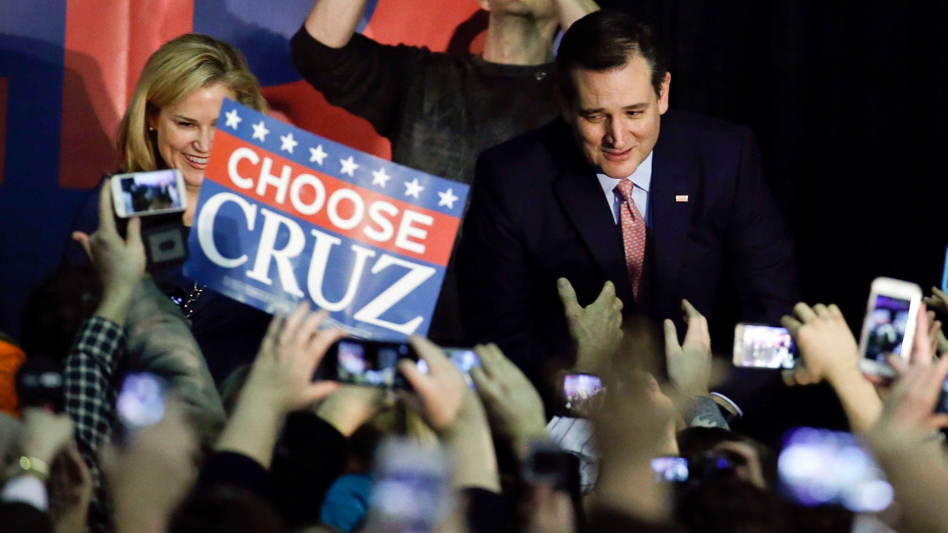 Republican presidential candidate, Sen. Ted Cruz, R-Texas, arrives for a caucus night rally, Monday, Feb. 1, 2016, in Des Moines, Iowa. Cruz sealed a victory in the Republican Iowa caucuses, winning on the strength of his relentless campaigning and support from his party's diehard conservatives. (AP Photo/Chris Carlson)