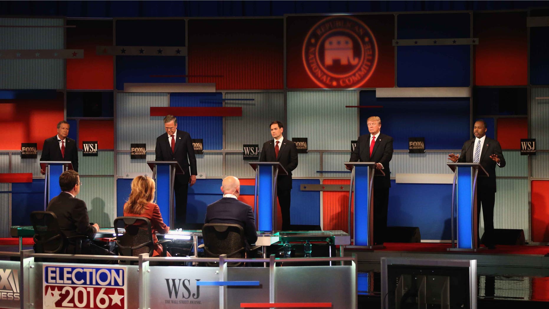 MILWAUKEE, WI - NOVEMBER 10: Presidential candidate Ben Carson speaks while Ohio Governor John Kasich (L-R), Jeb Bush, Sen. Marco Rubio (R-FL), Donald Trump look on during the Republican Presidential Debate sponsored by Fox Business and the Wall Street Journal at the Milwaukee Theatre November 10, 2015 in Milwaukee, Wisconsin. The fourth Republican debate is held in two parts, one main debate for the top eight candidates, and another for four other candidates lower in the current polls. (Photo by Scott Olson/Getty Images)