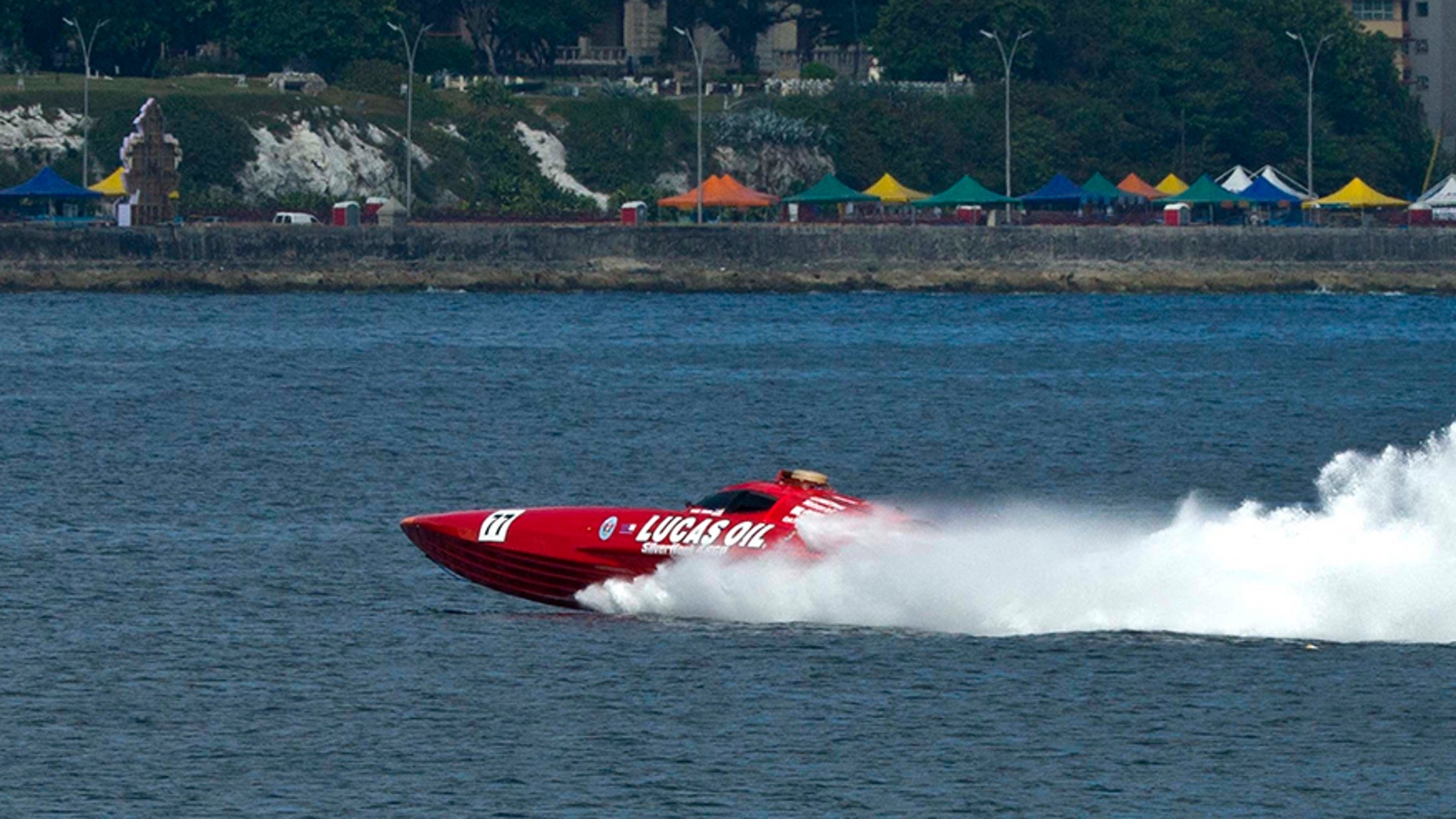 The Lucas Oil SilverHook powerboat arrives at speed in Havana, Cuba, Thursday, Aug. 17, 2017. The team is claiming a record for a powerboat crossing from Florida to Cuba. (AP Photo/Ramon Espinosa)
