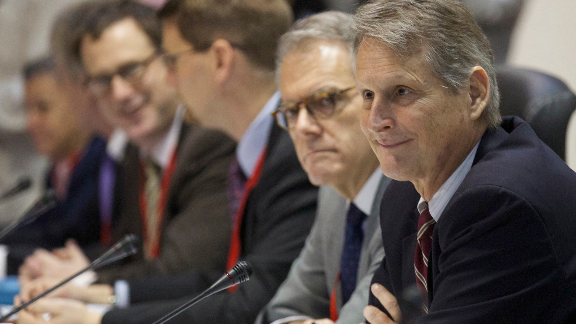Deputy Assistant Secretary at the U.S. State Department's Bureau of Western Hemisphere Affairs Edward Alex Lee, right, and members of a U.S. delegation in Havana, Cuba, Wednesday, Jan. 21, 2015.