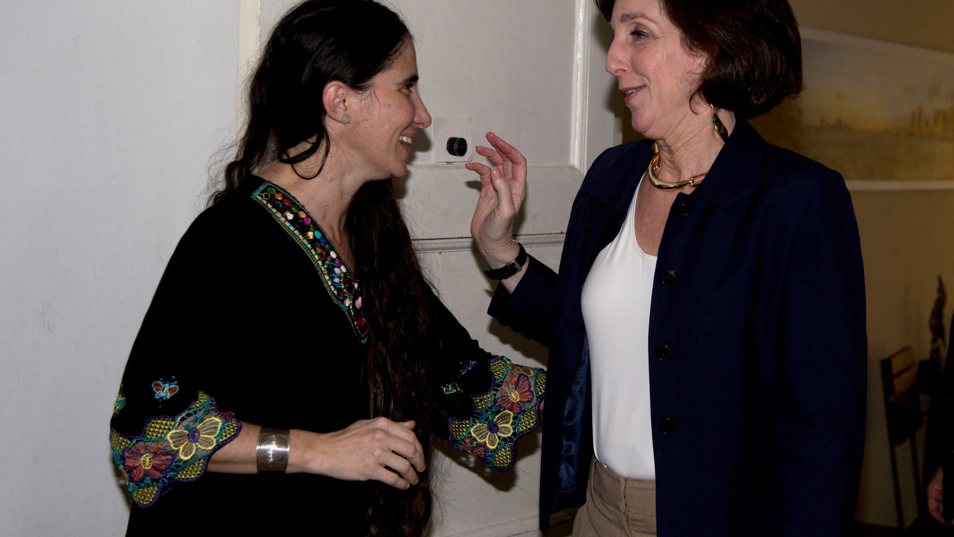 Assistant Secretary of State of the Bureau of Western Hemisphere Affairs Roberta S. Jacobson, right, talks with blogger and dissident Yoani Sanchez in Havana, Cuba, Friday, Jan. 23, 2015. (AP Photo/Desmond Boylan, Pool)