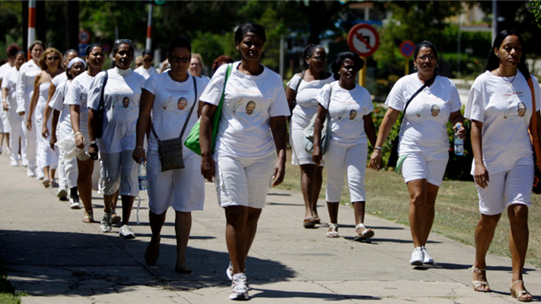 March 18, 2012: Members of dissident group Ladies in White take part in their weekly march in front of Santa Rita church in Havana, Cuba.