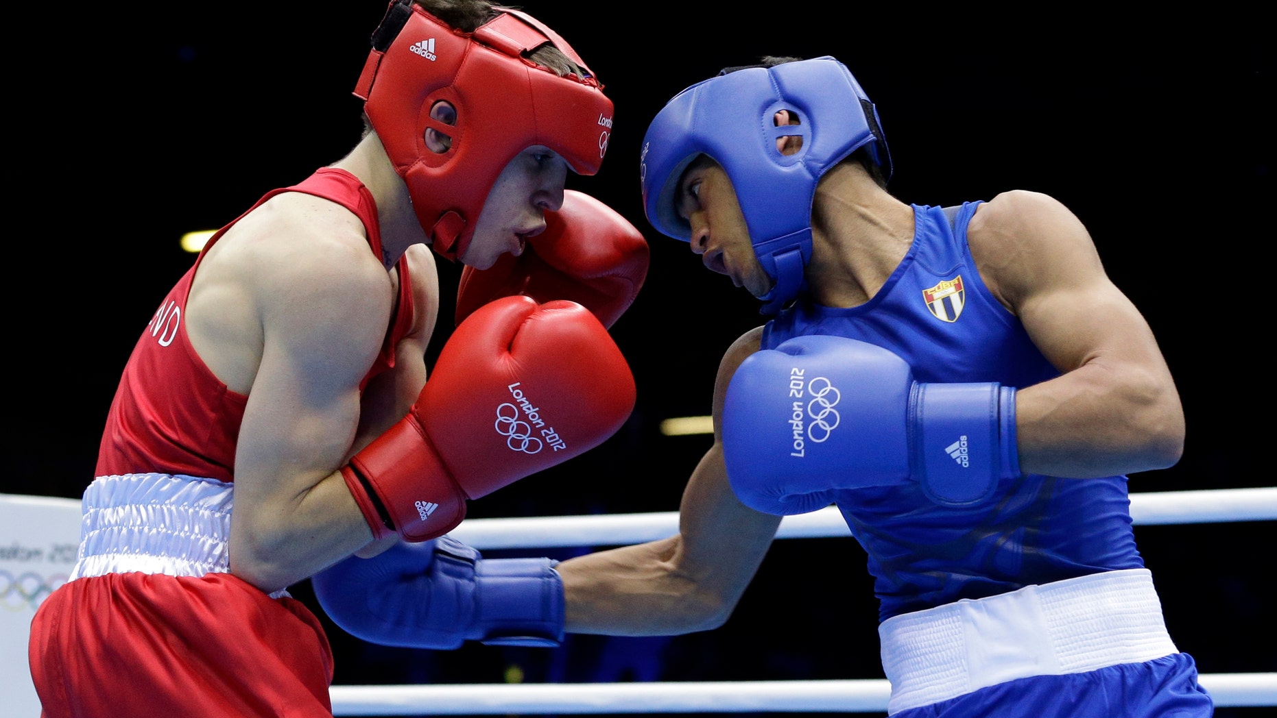 Aug. 10, 2012: Ireland's Michael Conlan, left, fights Cuba's Robeisy Ramirez Carrazana in a flyweight 52-kg semifinal boxing match at the 2012 Summer Olympics, Friday, in London.