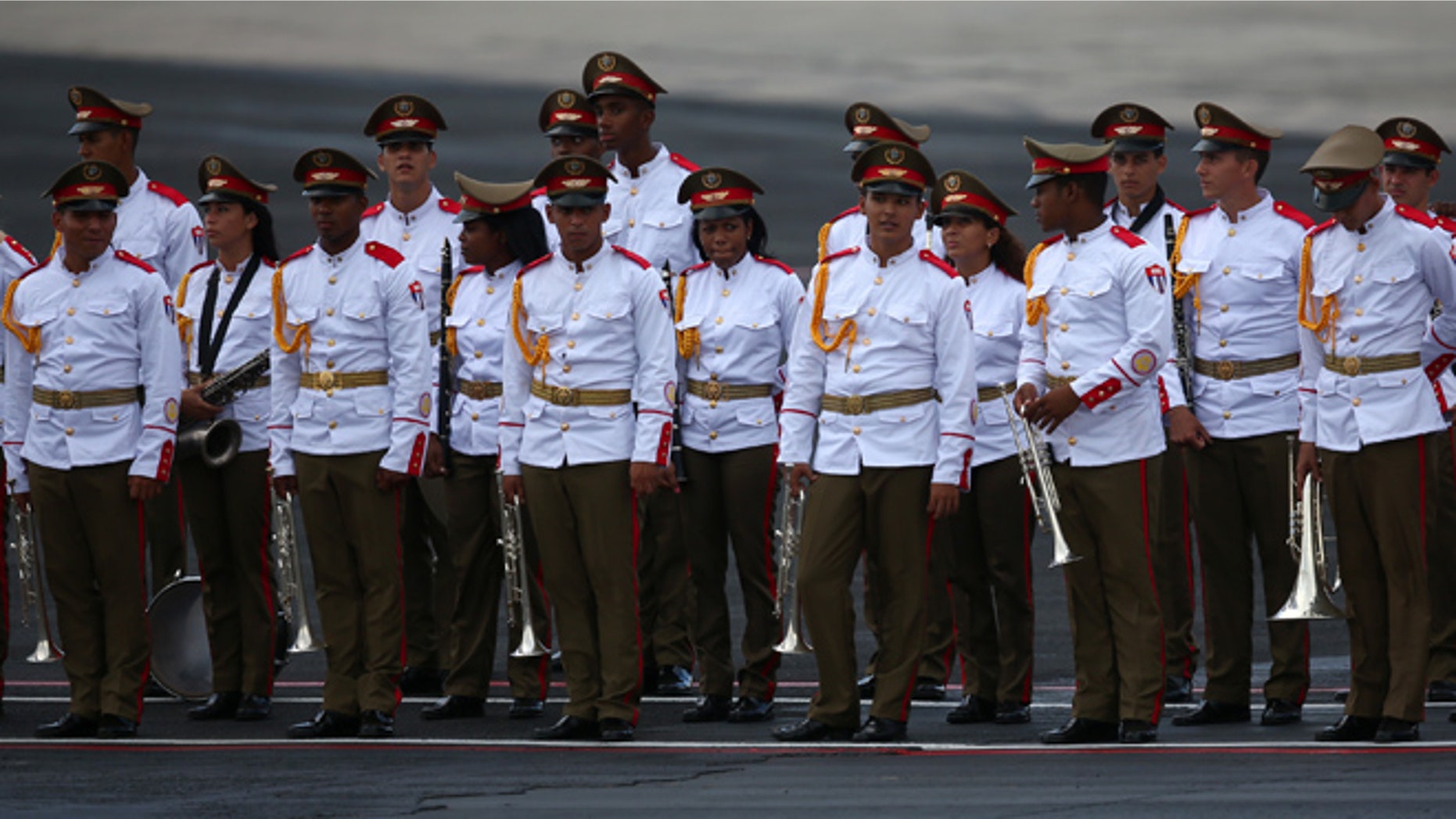 HAVANA, CUBA - SEPTEMBER 19: Cuban military personnel await the arrival of Pope Francis at Jose Marti International Airport on September 19, 2015 in Havana, Cuba. Pope Francis is at the beginning of a three day visit to Cuba where he will meet President Raul Castro and hold Mass in Revolution Square before travelling to Holguin, Santiago de Cuba and El Cobre then onwards to the United States. (Photo by Carl Court/Getty Images)
