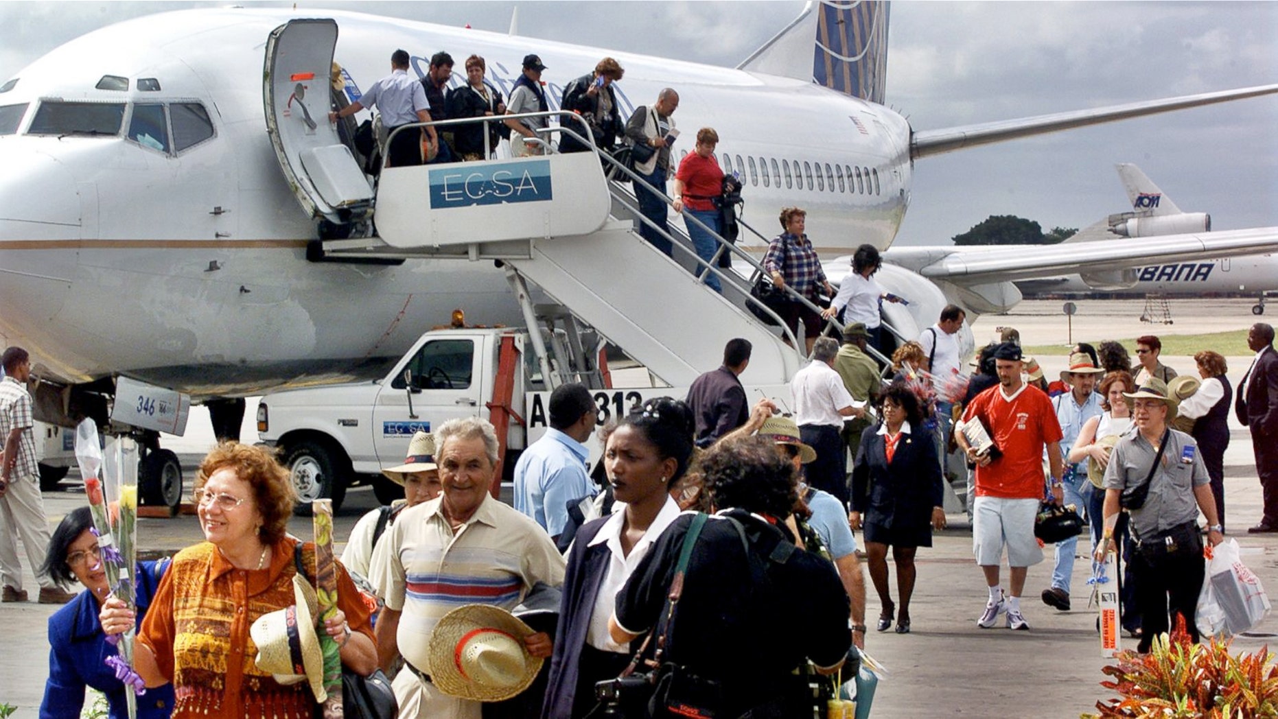 FILE:The first passengers of the first chartered flight of Continental Airlines from Miami Florida, arrives at the Jose Marti Airport of Havana, Cuba.