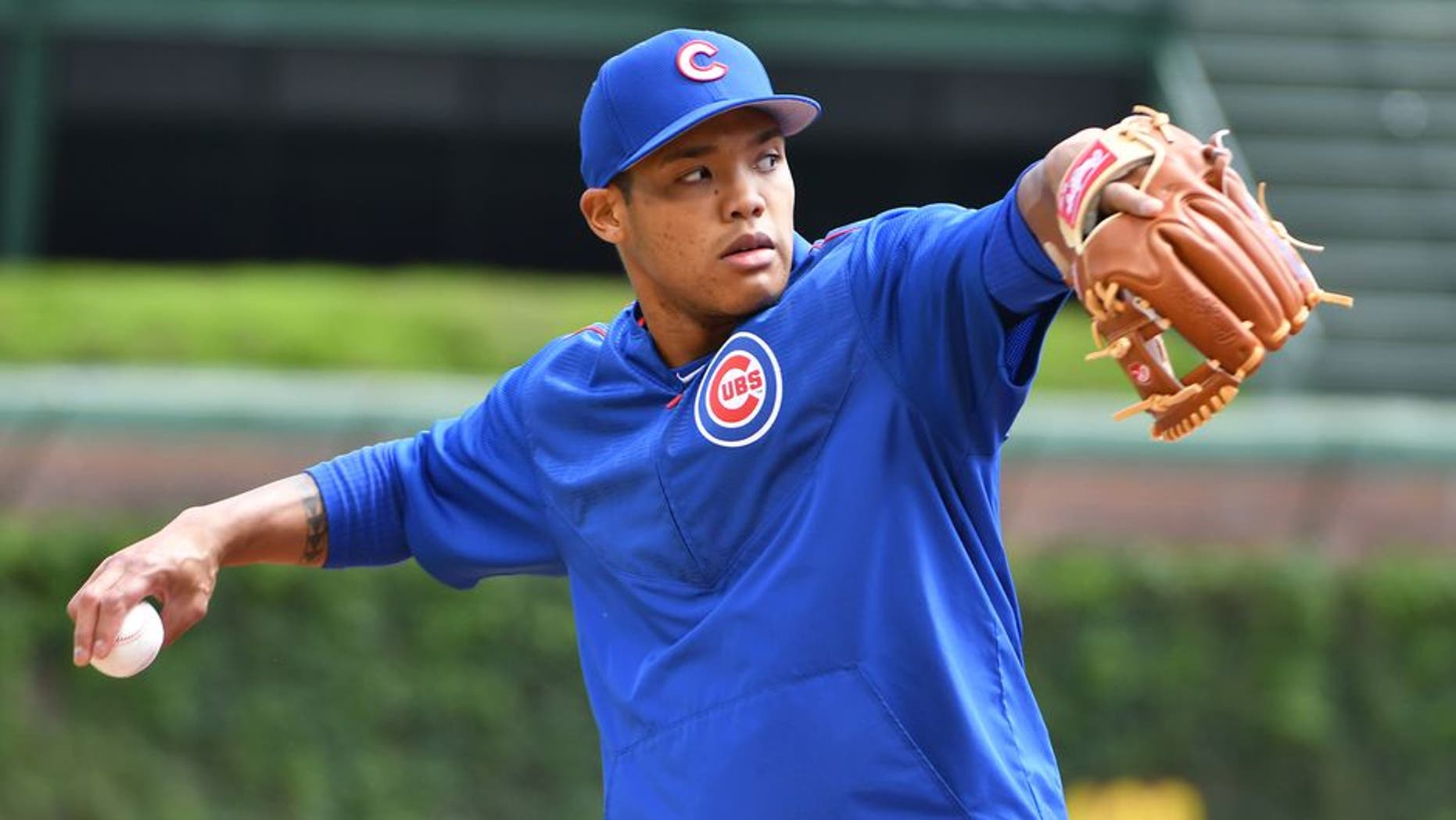 CHICAGO, IL - MAY 21: Chicago Cubs Shortstop Addison Russell (27) warms up before a MLB game between the Chicago Cubs and Milwaukee Brewers on May 21, 2017 at Wrigley Field in Chicago, IL. The Cubs defeated the Brewers 13-6. (Photo by Nick Wosika/Icon Sportswire via Getty Images)