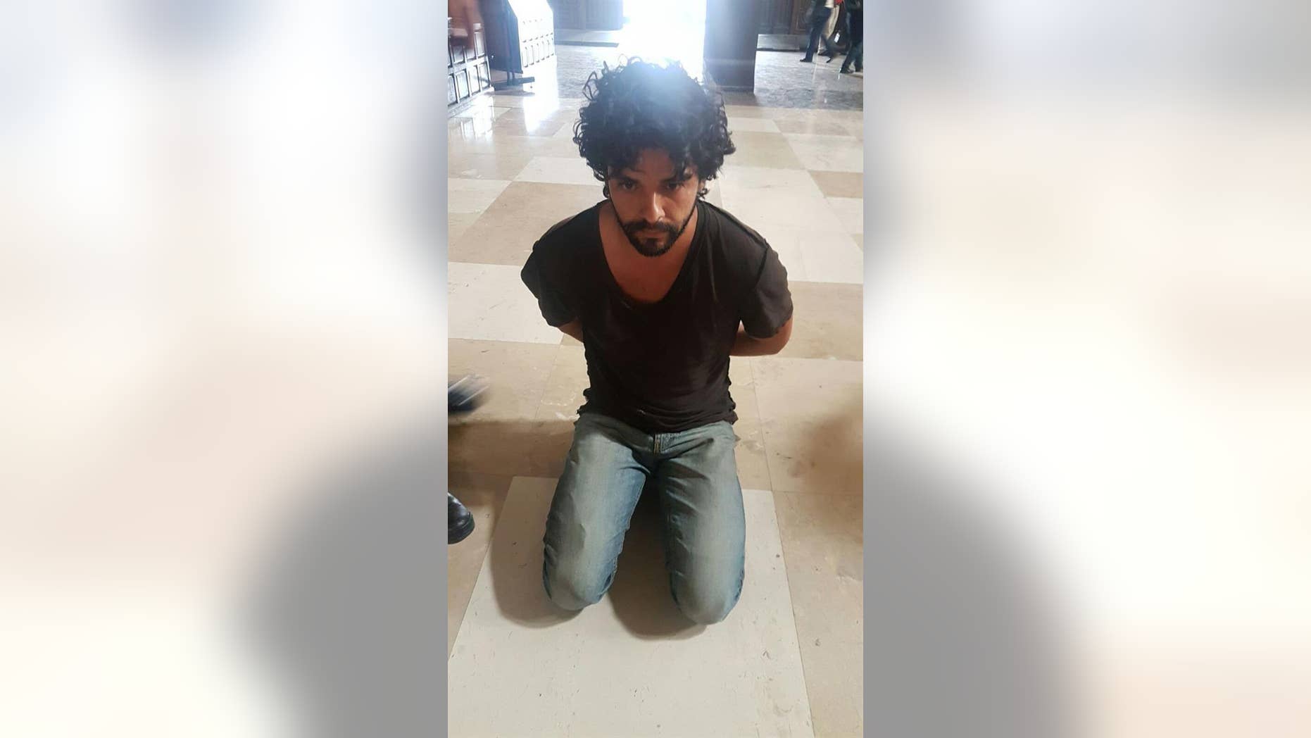 An American man identified as John Rock Schild arrested for stabbing a priest on May 15, 2017.