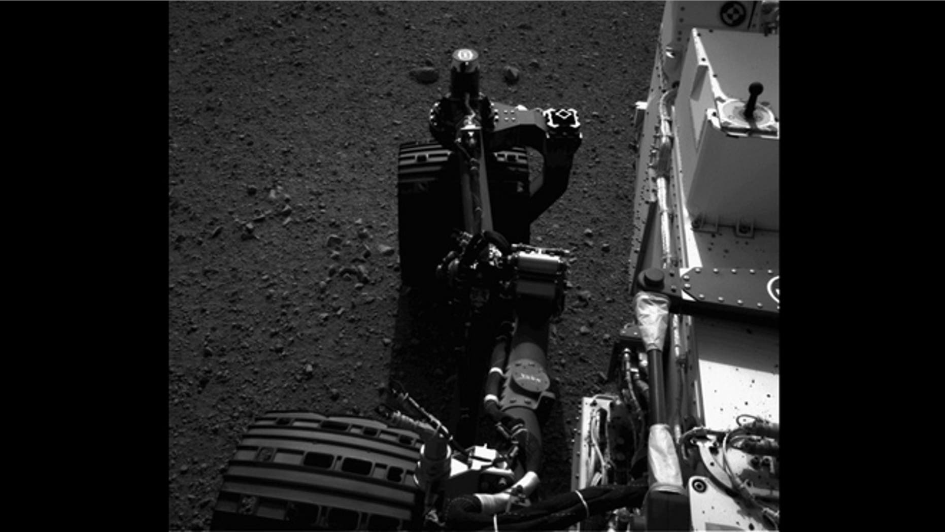This still from a set of images shows the movement of the front left wheel of NASA's Curiosity as rover drivers turned the wheels in place at the landing site on Mars. Engineers wiggled the wheels as a test of the rover's steering and anticipate embarking on Curiosity's first drive in the next couple of days. This image was taken by one of Curiosity's Navigation cameras on Aug. 21, 2012