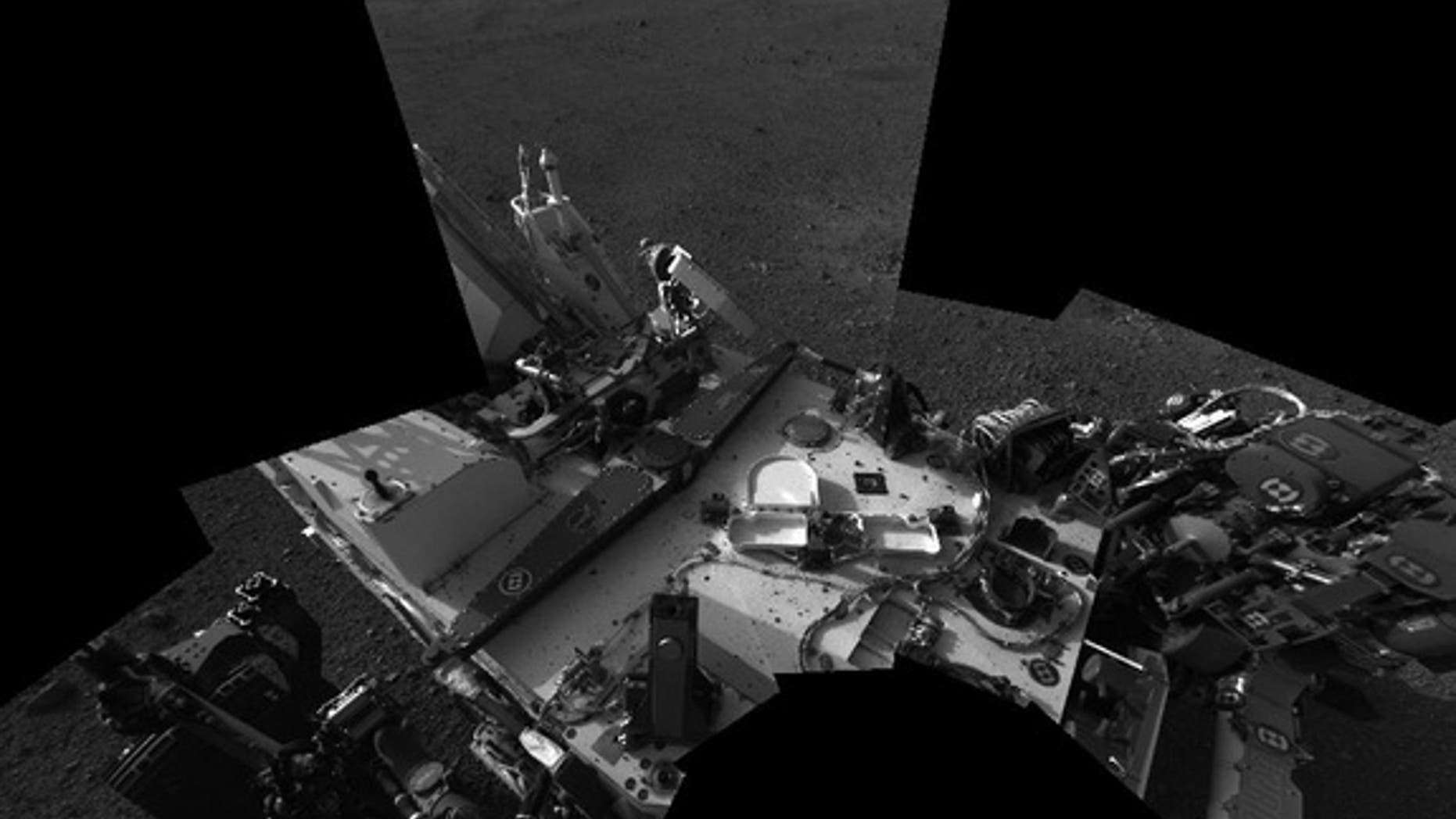 This view of Mars, taken by NASA's Curiosity rover on Sol 3 (Aug. 8-9, 2012), shows an early view of the rover's deck as viewed from mast cameras.