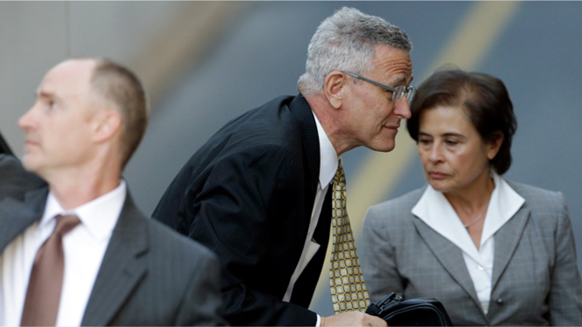 July 29, 2013: Former Penn State director of athletics Tim Curley enters the Dauphin County Courthouse in Harrisburg, Pa. Curley, Graham Spanier and Gary Schultz are to go before a judge Monday to determine whether the three must face trial on charges they covered up an allegation that Jerry Sandusky was sexually preying on boys. (AP/Matt Rourke)