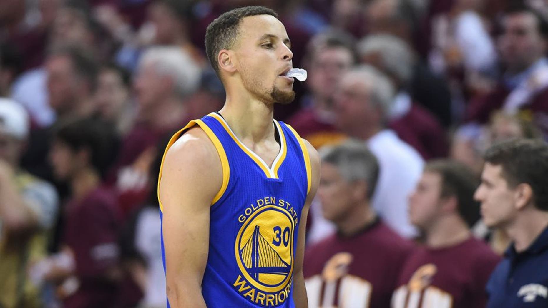 Jun 8, 2016; Cleveland, OH, USA; Golden State Warriors guard Stephen Curry (30) reacts while walking to the bench during the second quarter in game three of the NBA Finals against the Cleveland Cavaliers at Quicken Loans Arena. Mandatory Credit: Ken Blaze-USA TODAY Sports