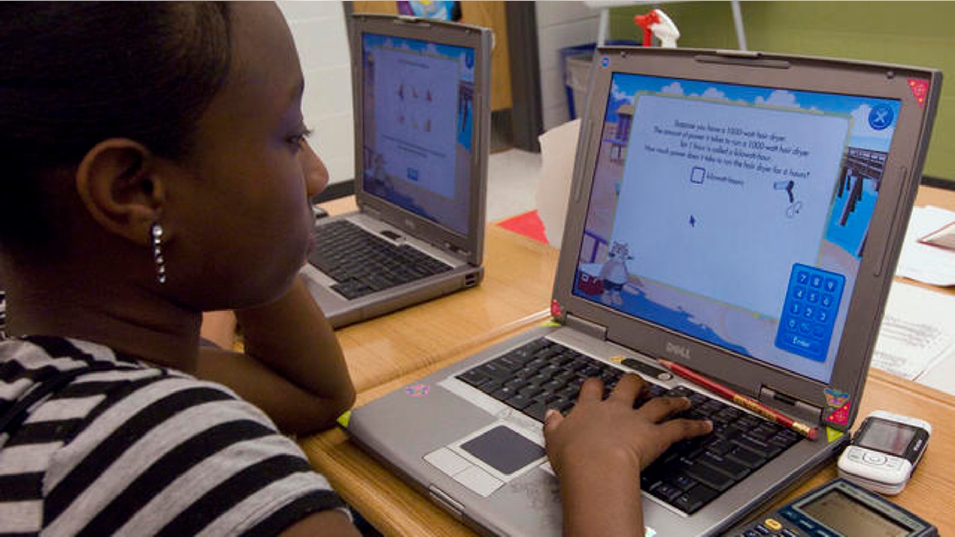 Destinee Brown, 14, and eighth grade student, works on her computer during math class at the Long Branch Middle School, a school in restructuring in the working-class New Jersey shore town of Long Branch, N.J., Friday, June 1, 2007. (Colin Archer/AP Photo)