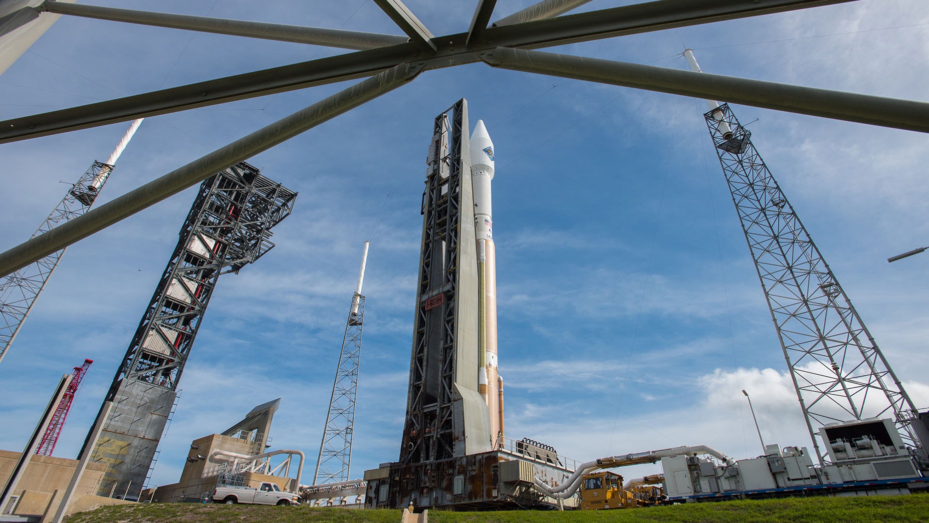 In this photo provided by the United Launch Alliance, an Atlas V rocket carrying the Orbital ATK Cygnus spacecraft, is rolled from the Vertical Integration Facility to a launch pad at the Cape Canaveral Air Force Station in Cape Canaveral, Fla., on Wednesday, Dec. 2, 2015. (United Launch Alliance via AP)