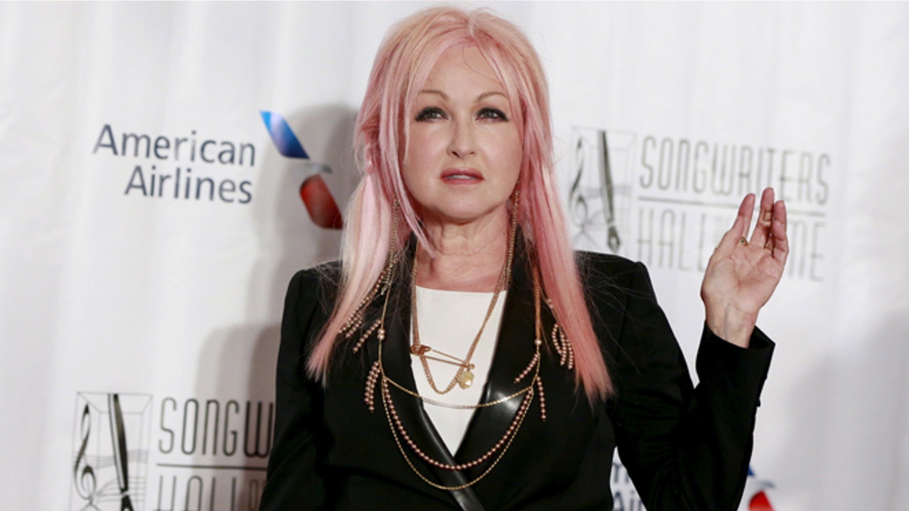 June 18, 2015. Singer Cyndi Lauper poses on the red carpet before the Songwriters Hall of Fame ceremony in New York.