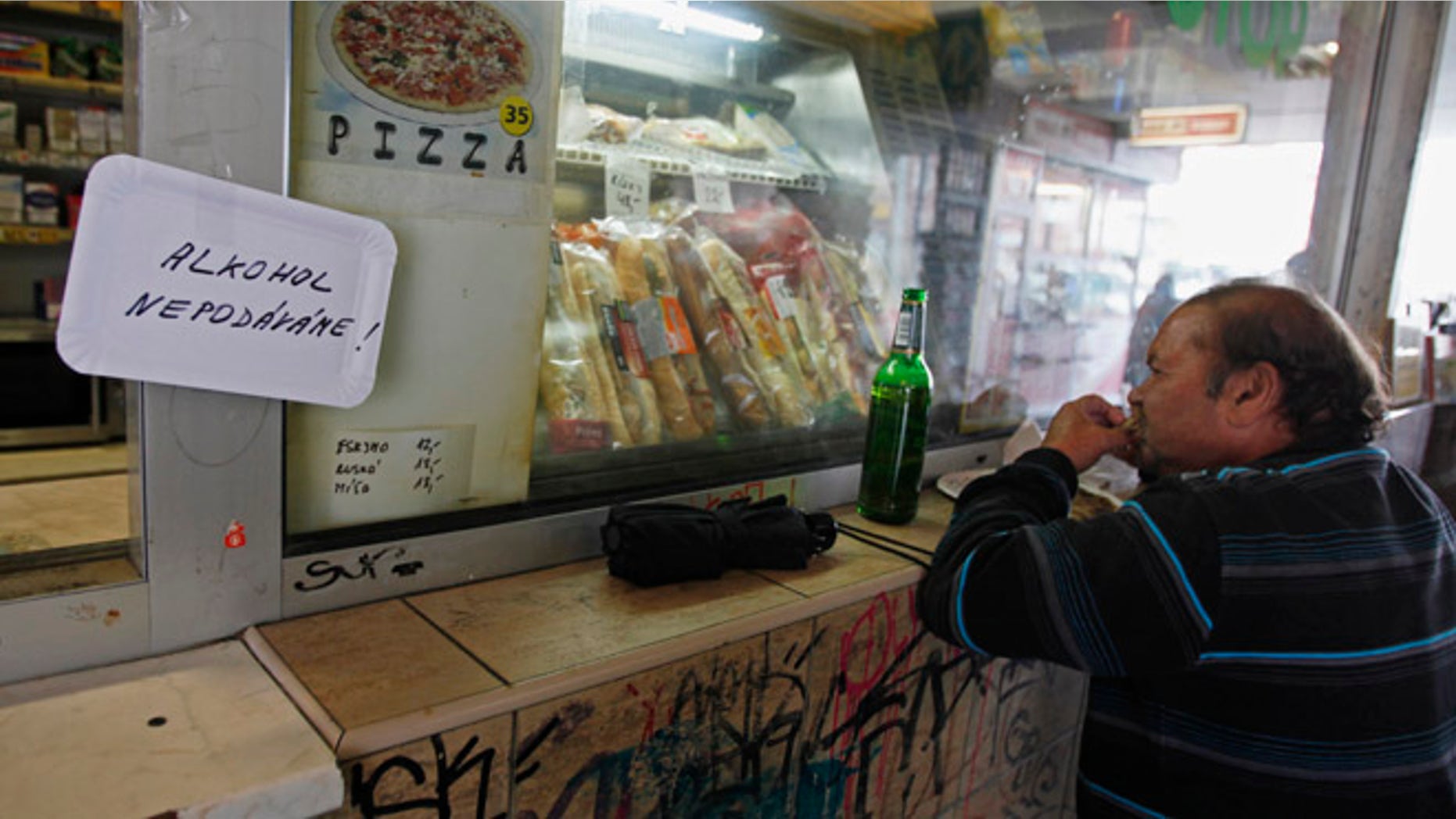 September 13, 2012: A man drinks a beer in Prague, where critics say it's cheaper to buy a brew than a cup of water.