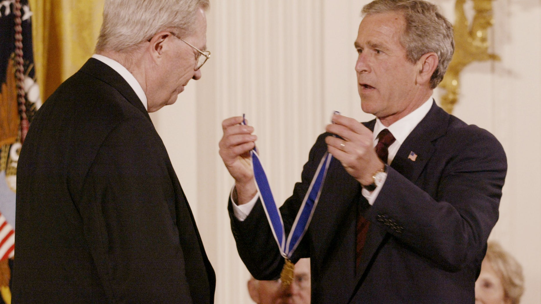 Then U.S. President George W. Bush presents D.A. Henderson, who is credited with eradicating smallpox worldwide, with the Presidential Medal of Freedom at the White House, July 9, 2002.