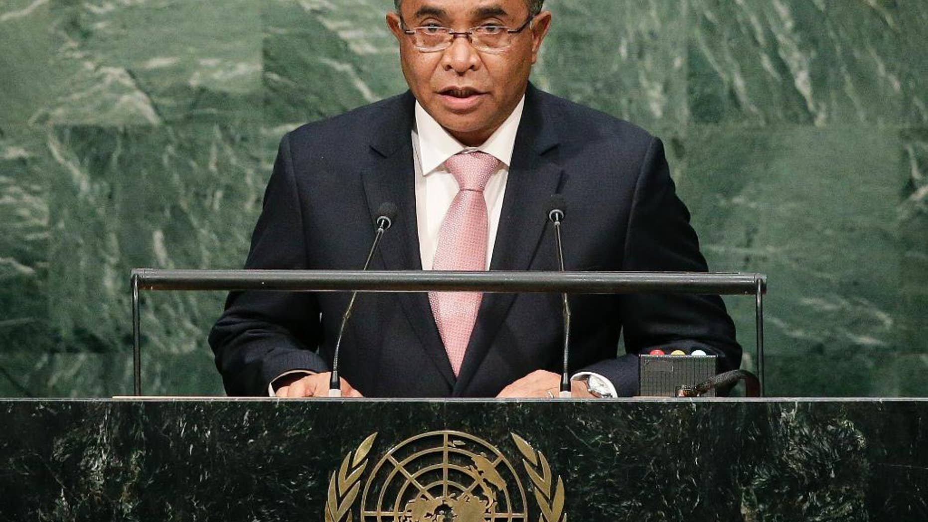 FILE - In this Oct. 1, 2015 file photo, East Timorese Prime Minister Rui Maria de Araujo speaks during the 70th session of the United Nations General Assembly at the U.N. headquarters. Two East Timorese journalists are going on trial in a criminal defamation case brought by Araujo that has alarmed press freedom groups. Raimundos Oki and his former boss Lourenco Vicente Martins are charged with "slanderous denunciation" and face up to three years in prison if found guilty. The trial is set to begin Friday, Oct. 7, 2016. Oki and Martins published a story in the Timor Post last year about Araujo’s involvement in a state contract for information technology services when he was an adviser to East Timor’s finance minister in 2014. (AP Photo/Julie Jacobson, File)