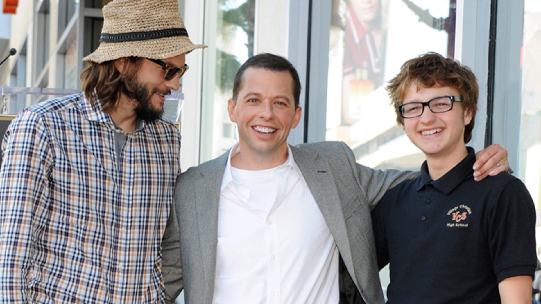 Angus T. Jones, right, poses with his "Two and a Half Men" costars.