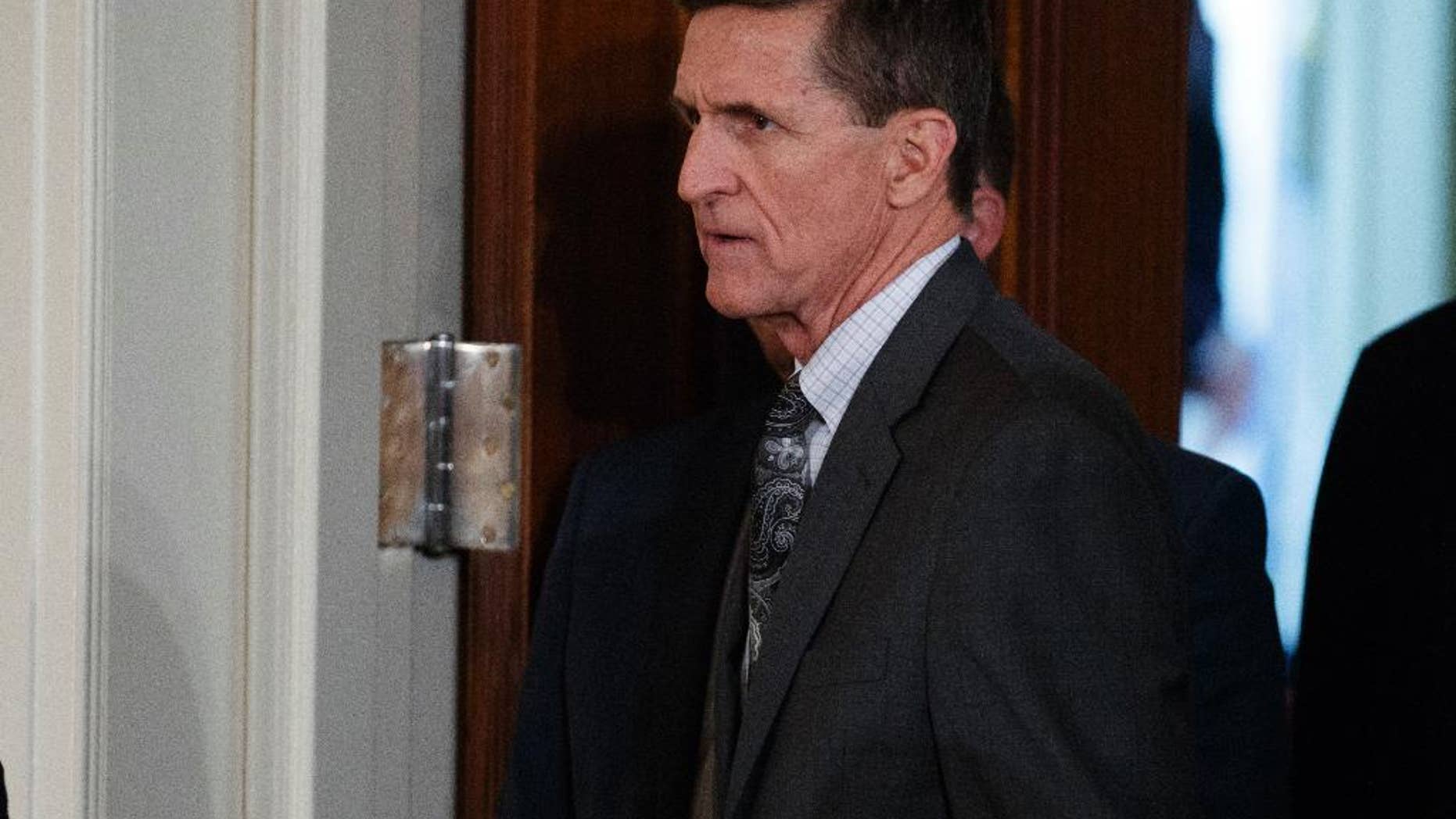 FILE - In this Feb. 13, 2017 file photo, Mike Flynn arrives for a news conference in the East Room of the White House in Washington. Targeted in widening investigations of his foreign entanglements, President Donald Trump’s former national security adviser, Michael Flynn, is at odds with his former Turkish client over two unusual payments totaling $80,000 that Flynn’s firm sent back last year to the client. The disagreement points to inconsistencies in Flynn’s accounts to the U.S. government about his work for foreign interests.(AP Photo/Evan Vucci, File)