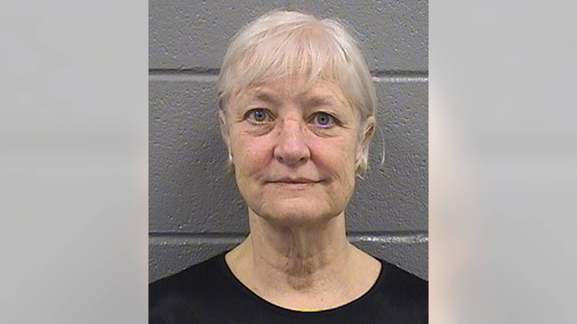 This undated booking photo provided by the Cook County Sheriff's Department shows 63-year-old Marilyn Hartman. Hartman was released from the Cook County Jail in Chicago on Thursday, July 2, 2015, and says she’s through with her run of stowaway attempts. She was arrested April 24, for loitering in a restricted area at O'Hare International Airport in Chicago. She was charged with misdemeanor criminal trespassing on state land and released. She was arrested again in Chicago on Sunday May 3, at Midway International Airport and charged with the same offense in addition to violating her bail bond. Hartman has succeeded in getting on a flight at least once without a ticket. She has previously said she's mentally ill and homeless. (Cook County Sheriff's Department via AP)