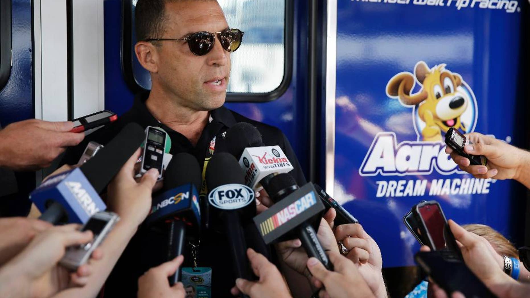 Team owner Rob Kauffman speaks to the media during a practice session for Sunday's NASCAR Pocono 400 auto race, Saturday, Aug. 1, 2015, in Long Pond, Pa. (AP Photo/Matt Slocum)