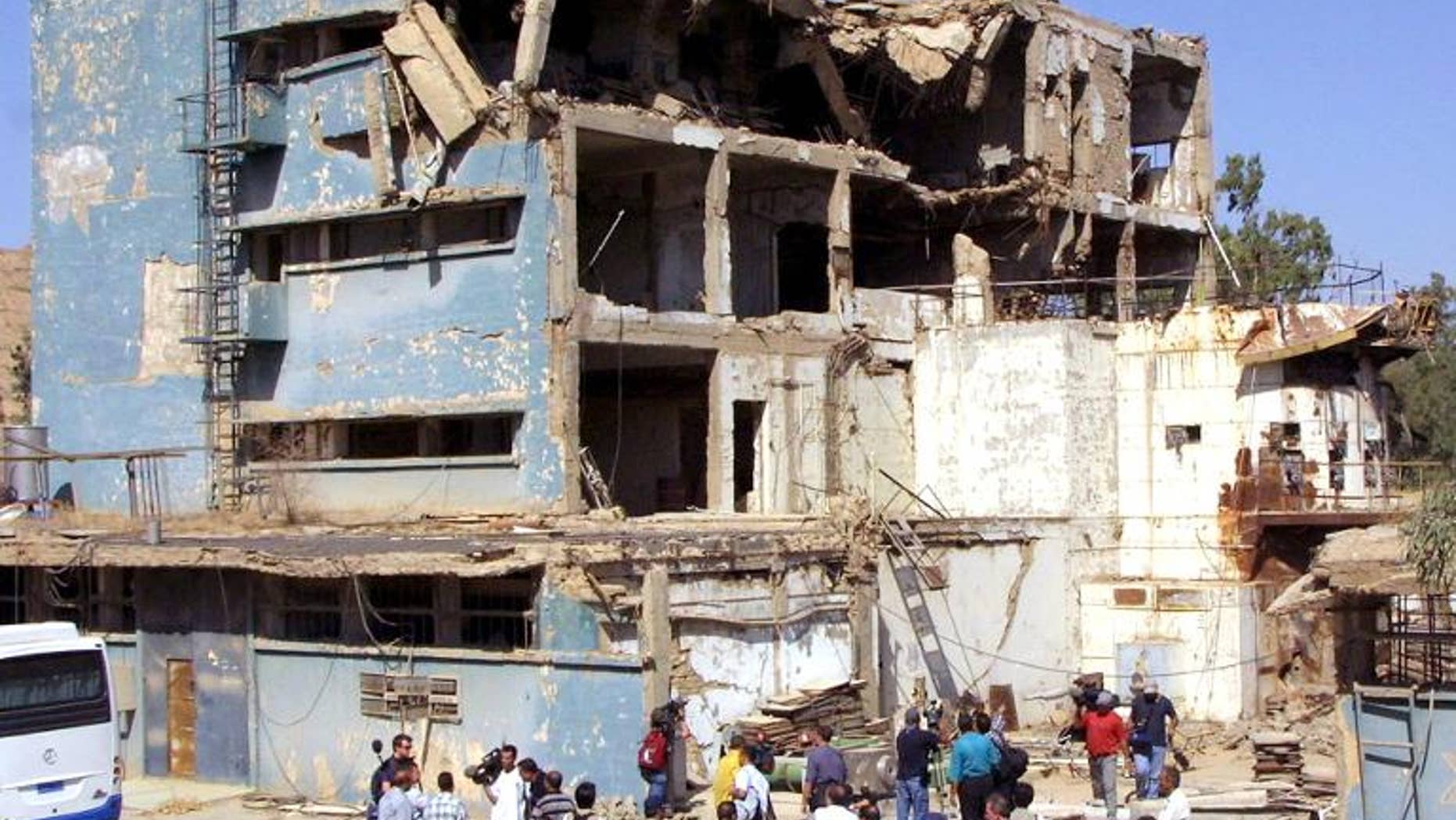 Journalists are shown Iraq's Osirak nuclear reactor in the town of al-Toweitheh, on September 9, 2002