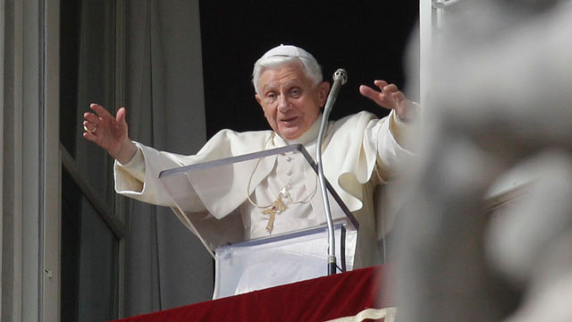Pope Benedict XVI delivers his message during his Angelus prayer from his studio window overlooking St. Peter's Square at the Vatican, Sunday, Nov. 14, 2010.