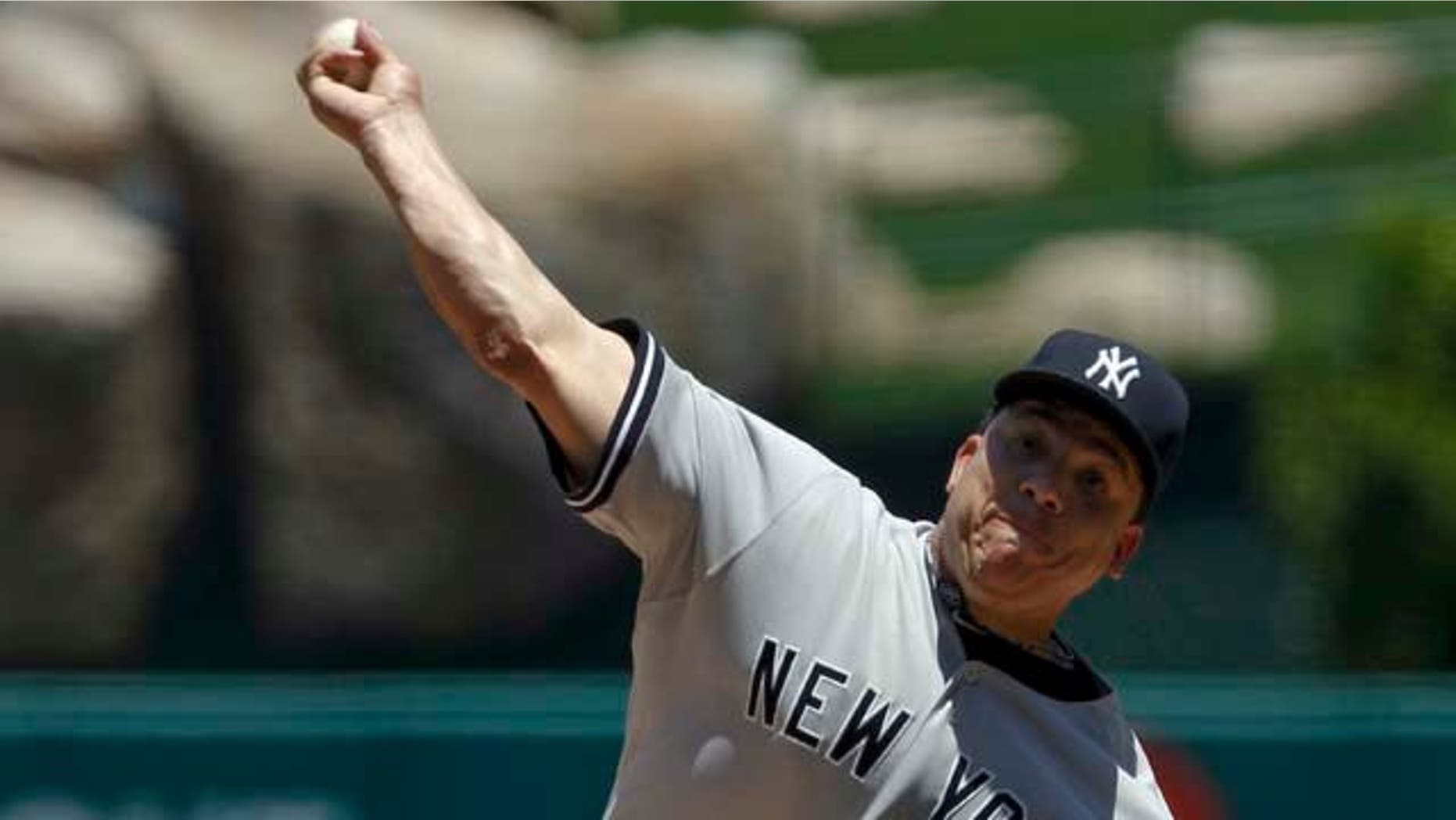 New York Yankees starting pitcher Bartolo Colon throws against the Los Angeles Angels during the first inning of a baseball game, Sunday, June 5, 2011, in Anaheim, Calif. (AP Photo/Chris Carlson)