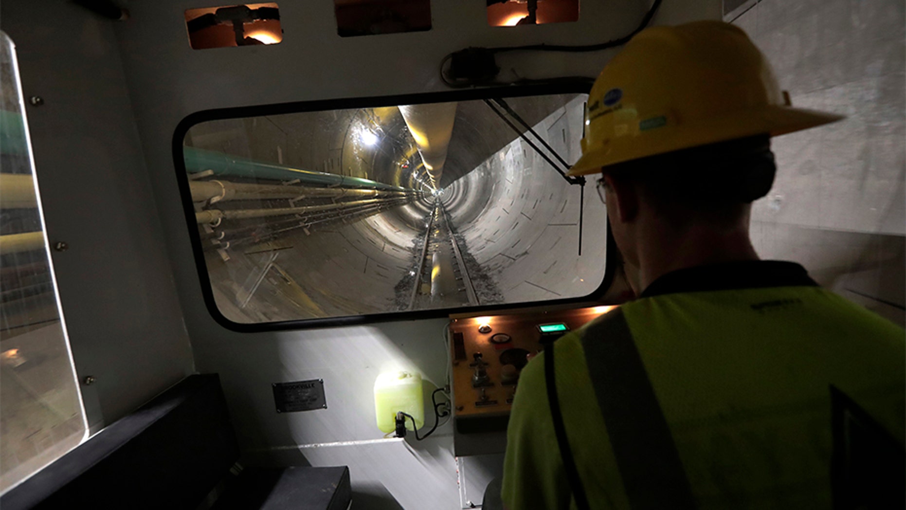 On May 16, operator Andrew Reisinger drives a personnel shuttle along a small gauge rail line inside a 2.5 - mile bypass tunnel being dug for the Delaware Aqueduct, in Marlboro, N.Y.