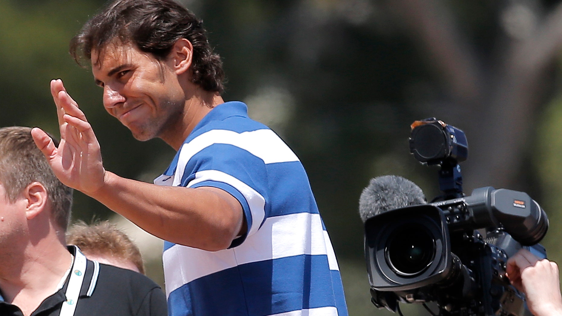 Spain's Rafael Nadal gestures during a TV interview at the Monte Carlo Tennis Masters tournament in Monaco, Monday, April 15 , 2013. (AP Photo/Lionel Cironneau)