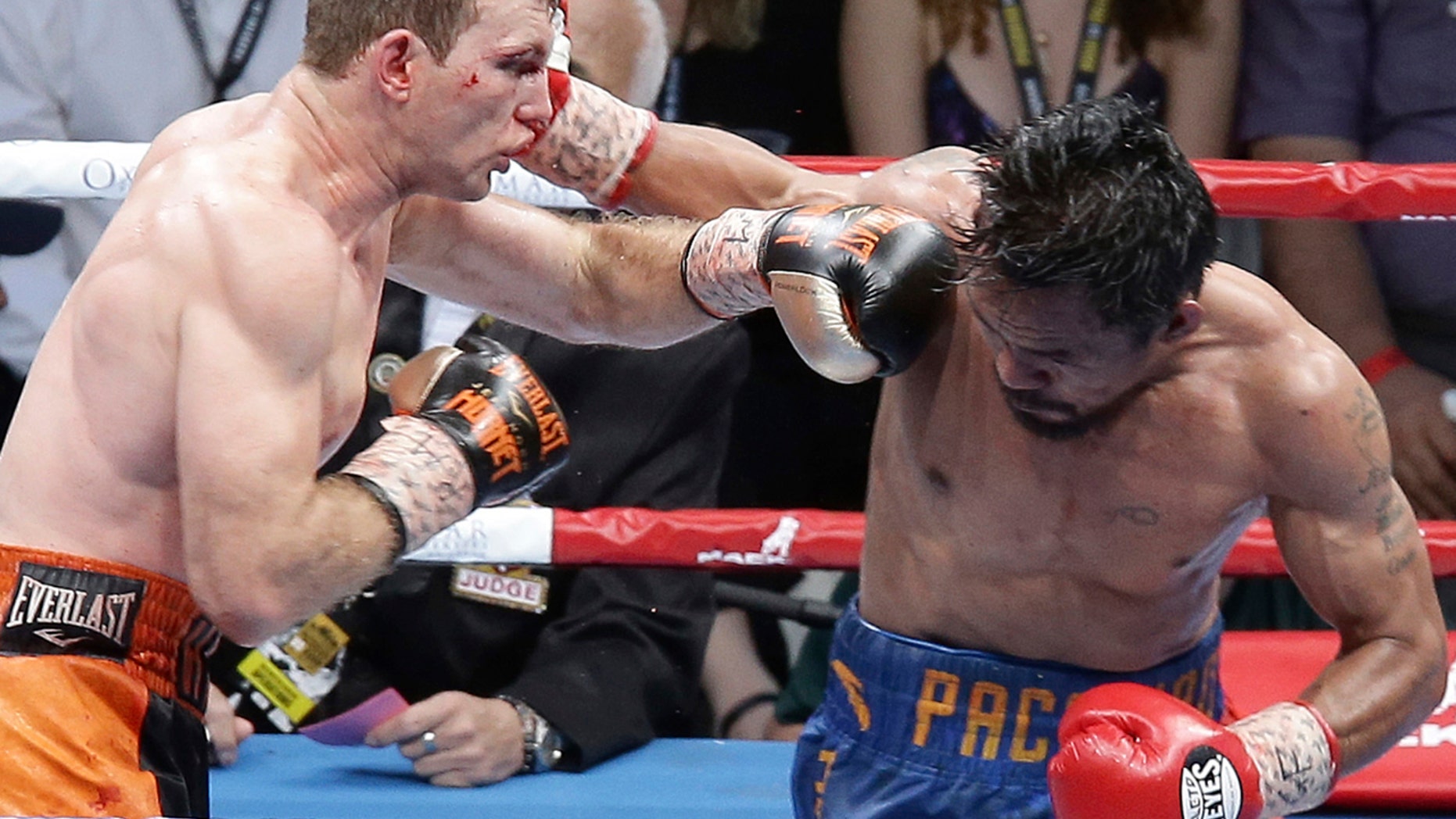 Jeff Horn of Australia, left, and Manny Pacquiao of the Philippines, right, lands a left to during their WBO World Welterweight title fight in Brisbane.
