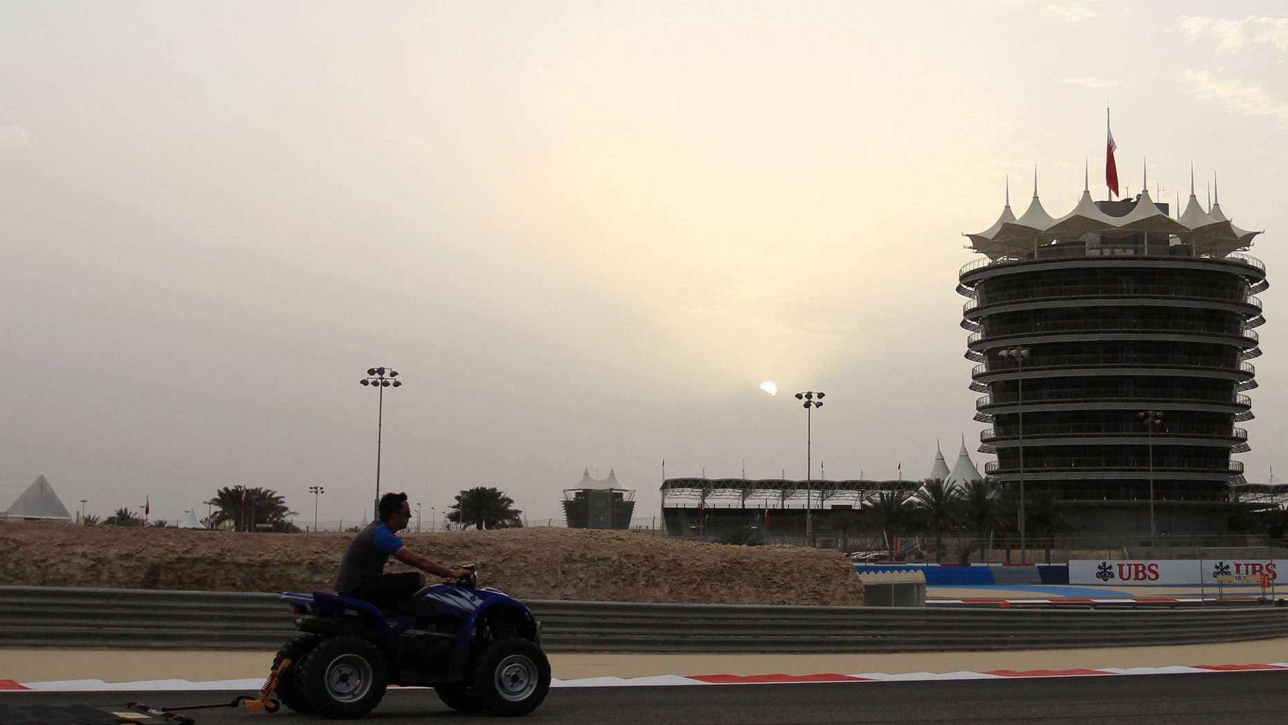 Track preparations are underway at the Bahrain International Circuit in Sakhir, Bahrain, on Wednesday, April 17, 2013. The F1 Bahrain Grand Prix will be held on Sunday. (AP Photo/Hasan Jamali)