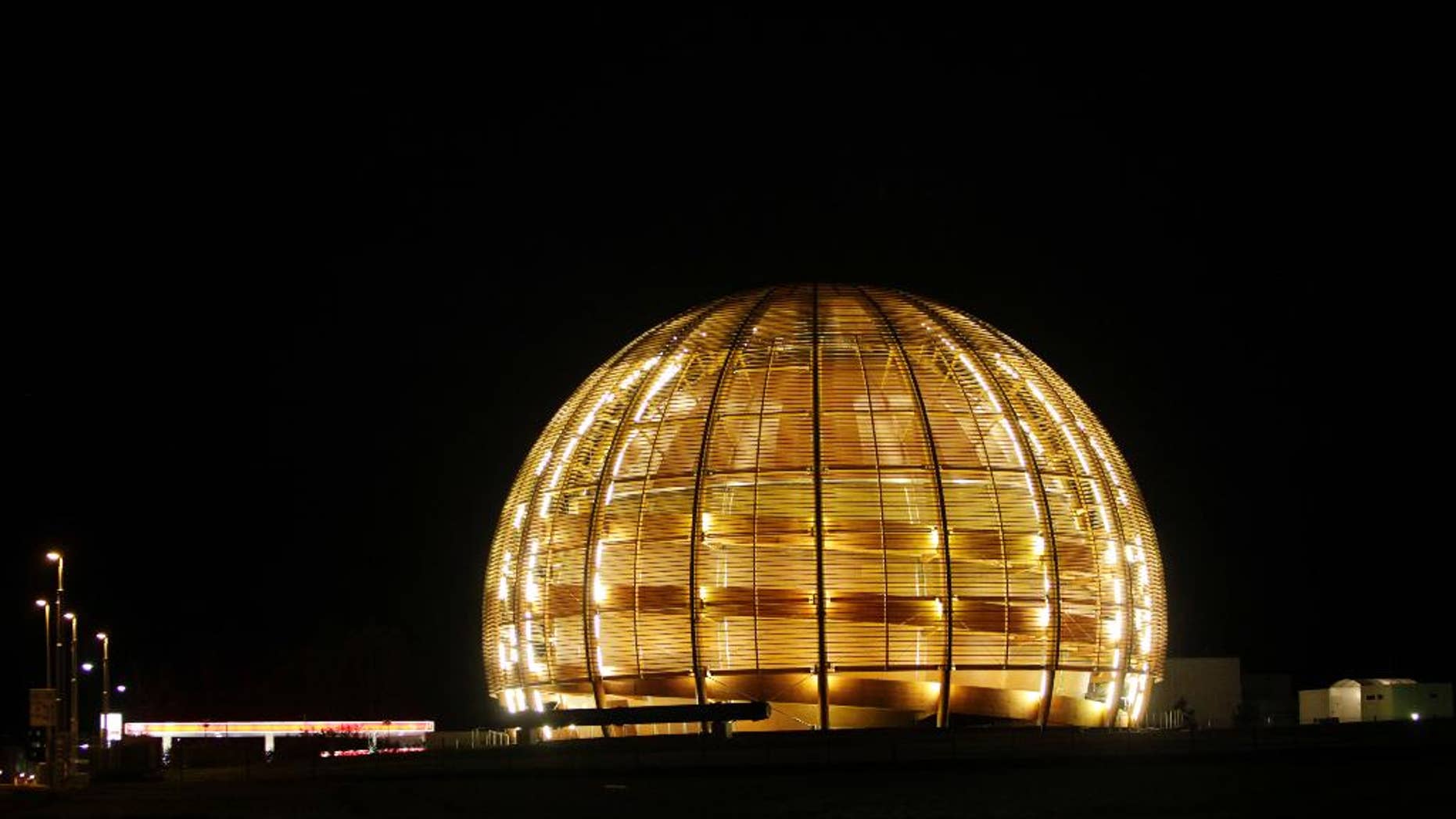 FILE - In this March 30, 2010 file picture the globe of the European Organization for Nuclear Research, CERN, is illuminated outside Geneva, Switzerland. (AP Photo/Anja Niedringhaus, file)