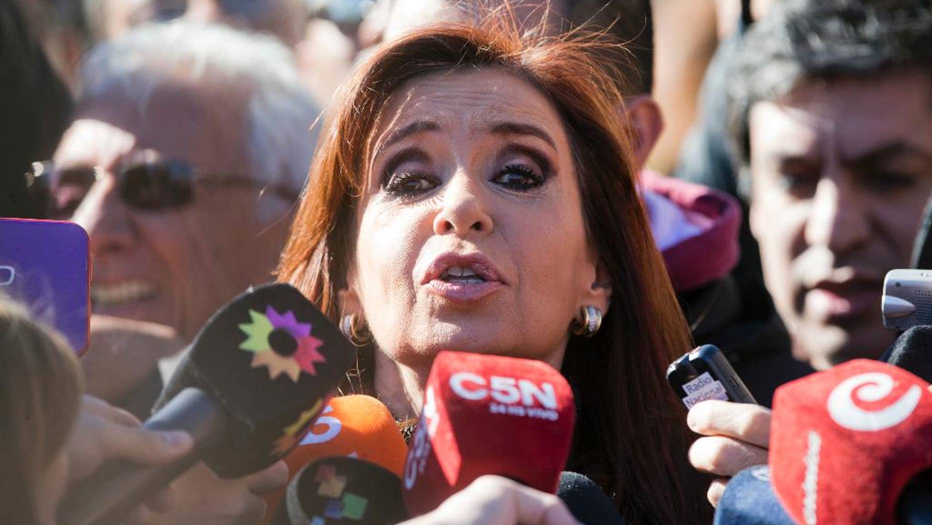 Argentina's former President Cristina Fernandez speaks to the media outside federal court in Buenos Aires, Argentina, Wednesday, July 6, 2016. Fernandez appeared in court to be notified that she is accused of an alleged scheme to manipulate Argentina's currency. (AP Photo/Victor R. Caivano)