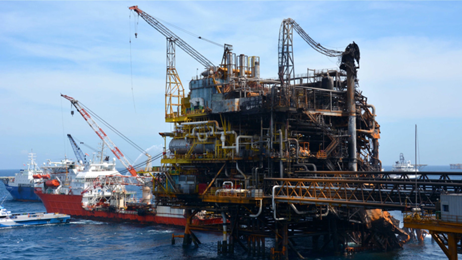 Emergency boats work to put out a fire at the Abkatun-A Permanente shallow-water oil platform in the Campeche Sound.