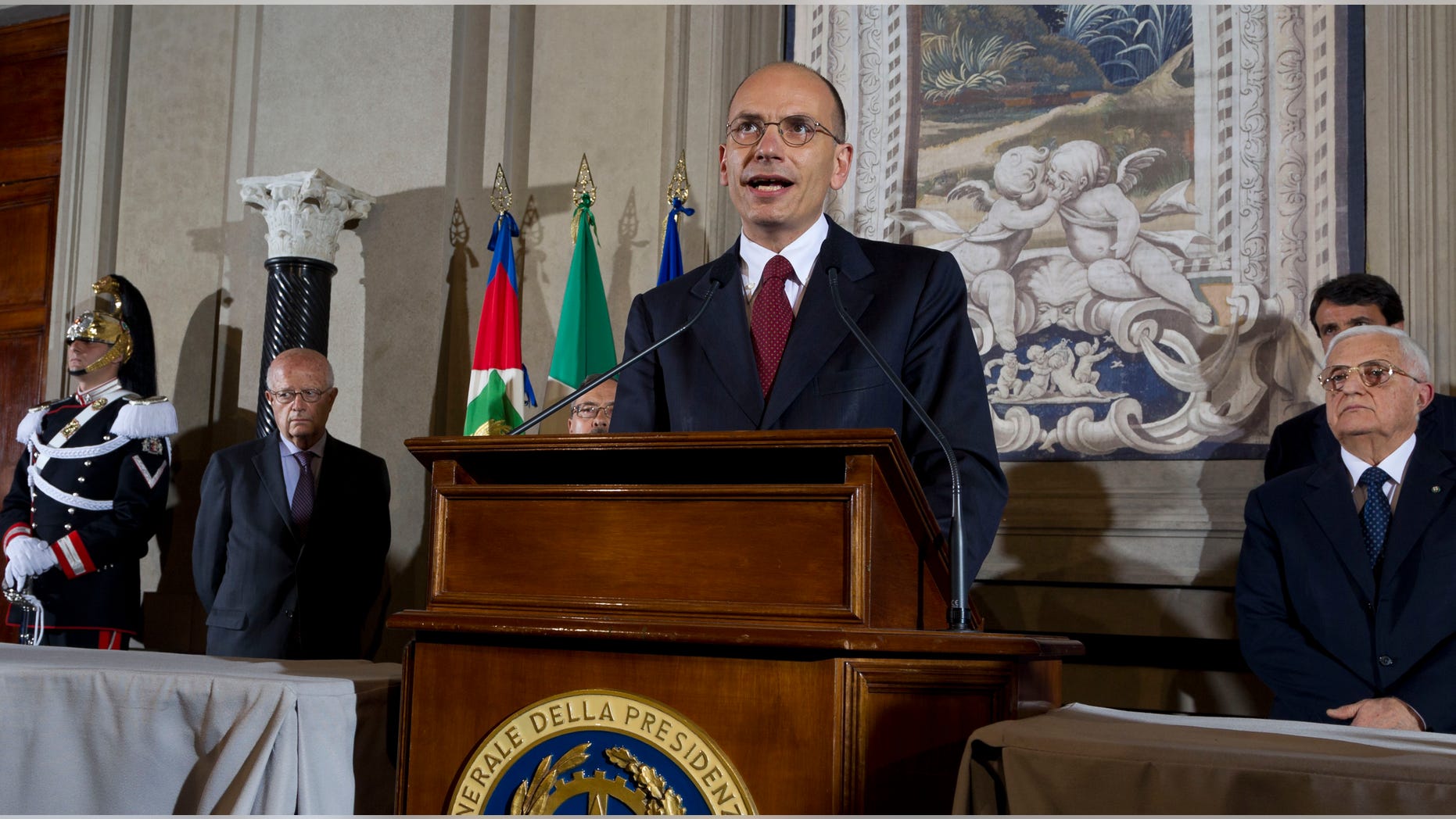 Italian Premier-designate Enrico Letta speaks during a press conference at the Quirinale Presidential Palace in Rome, Saturday, April 27, 2013. Italy has finally has a new government, a coalition of Berlusconi's forces and center-left rivals who forged an unusual alliance to break a two-month stalemate following inconclusive elections. Enrico Letta, a center-left leader, will be premier in the government, which marks the latest political comeback by Silvio Berlusconi. (AP Photo/Domenico Stinellis)